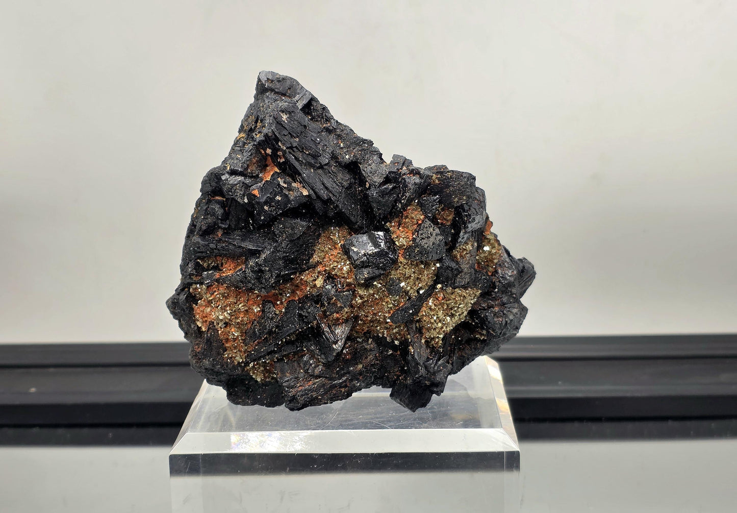 Large black tourmaline crystal cluster with mica, protective grounding stone.