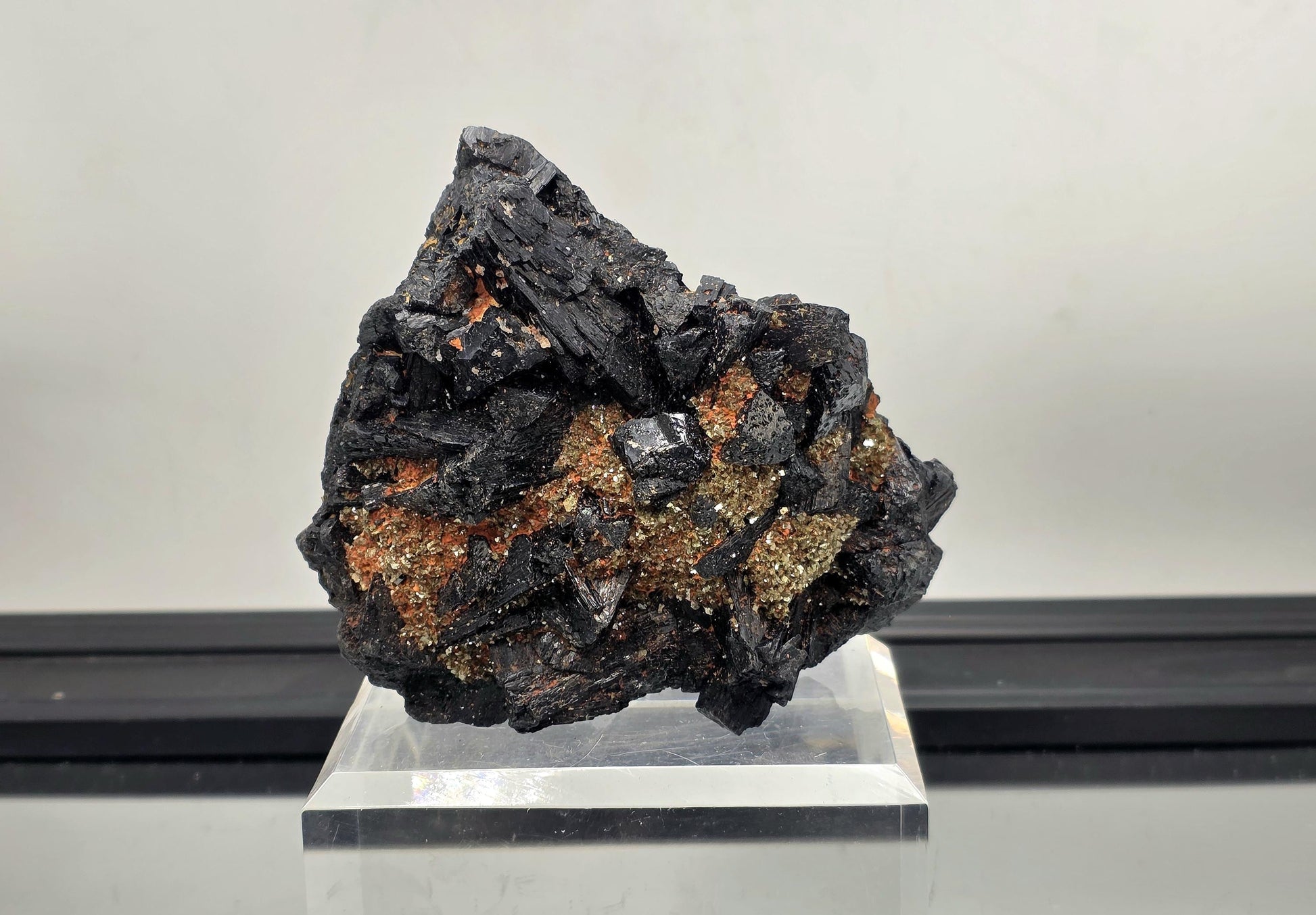 Large black tourmaline crystal cluster with mica, protective grounding stone.