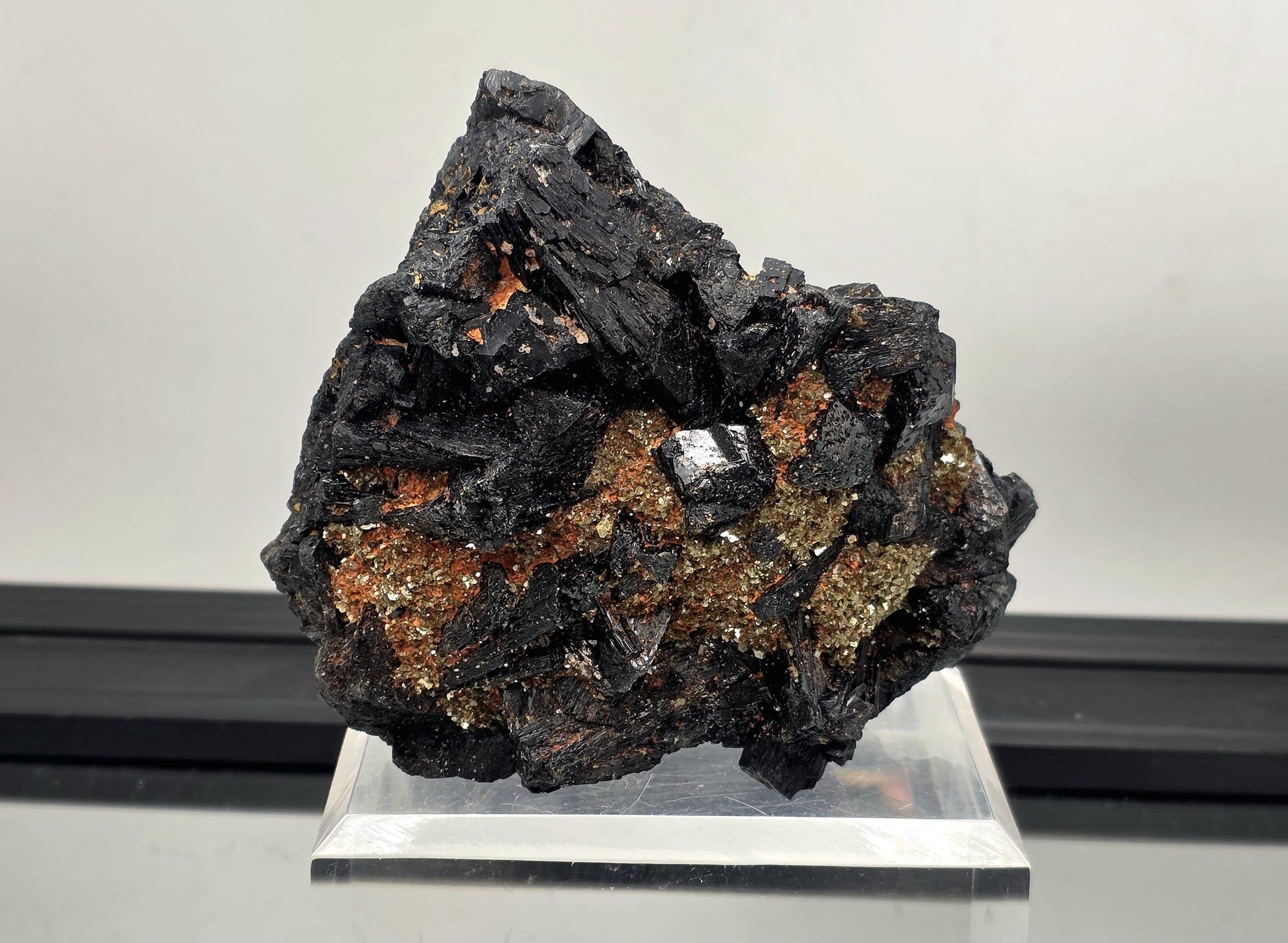 Large black tourmaline crystal specimen with mica, grounding mineral.