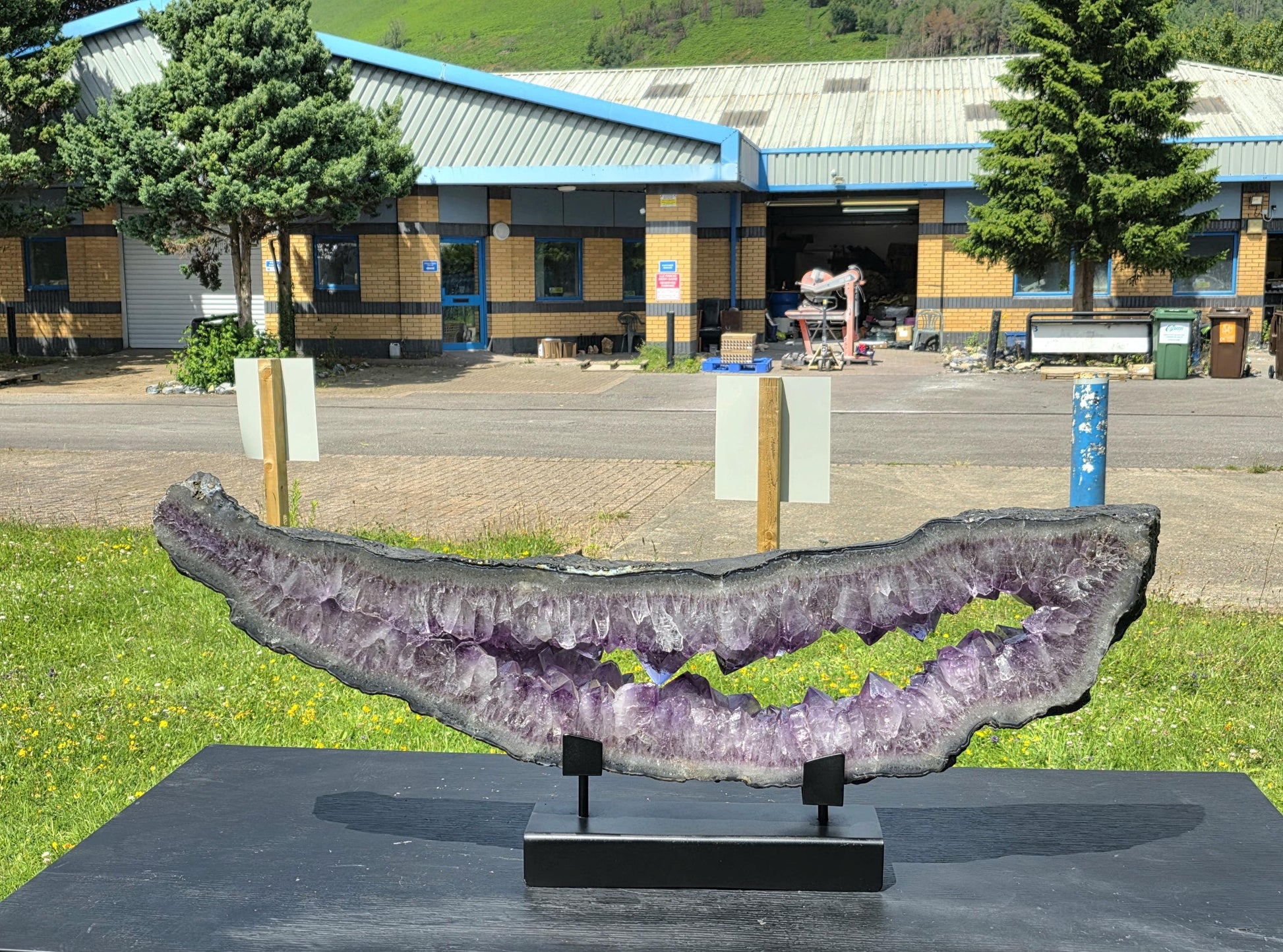 giant amethyst crystal on stand