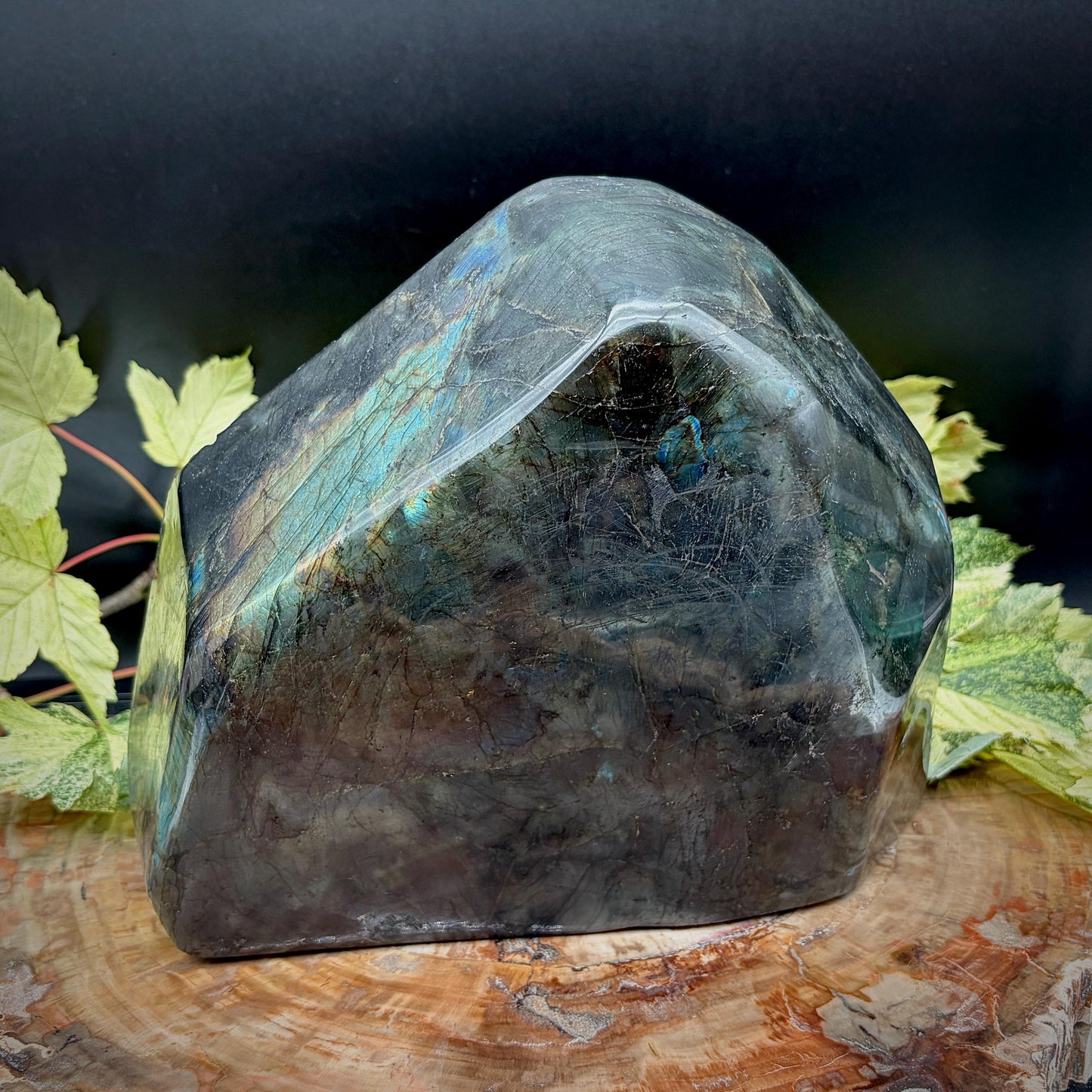 sacred om symbol carved into a large labradorite crystal freeform