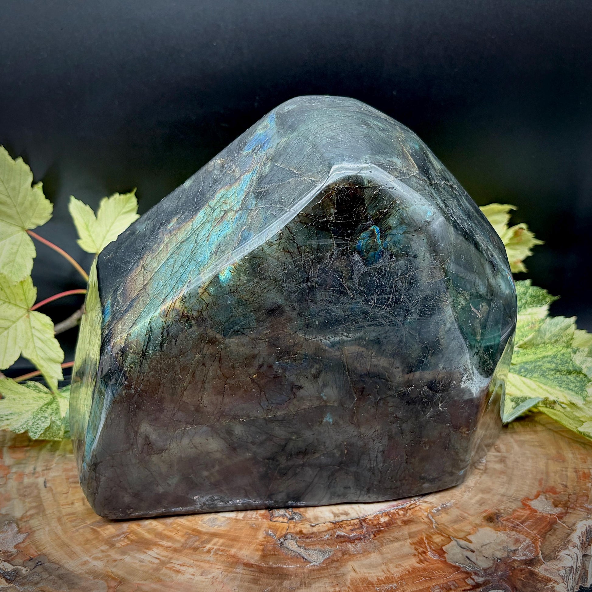 sacred om symbol carved into a large labradorite crystal freeform
