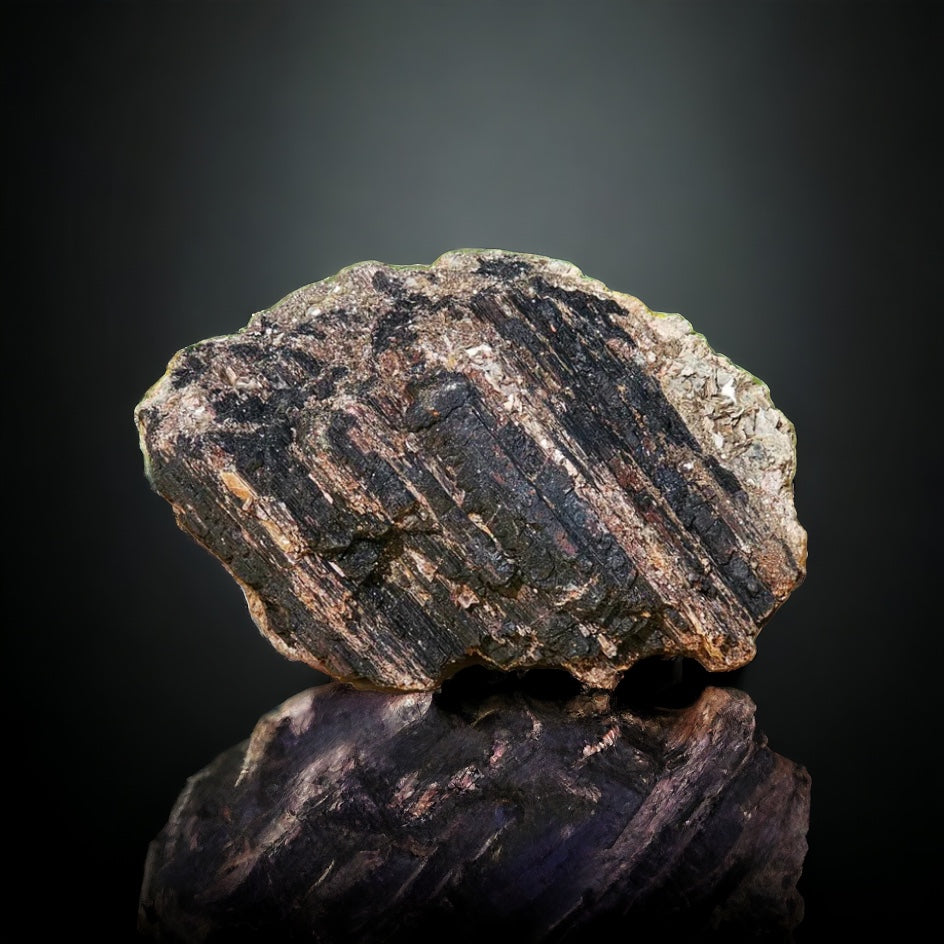 large black tourmaline crystal with mica
