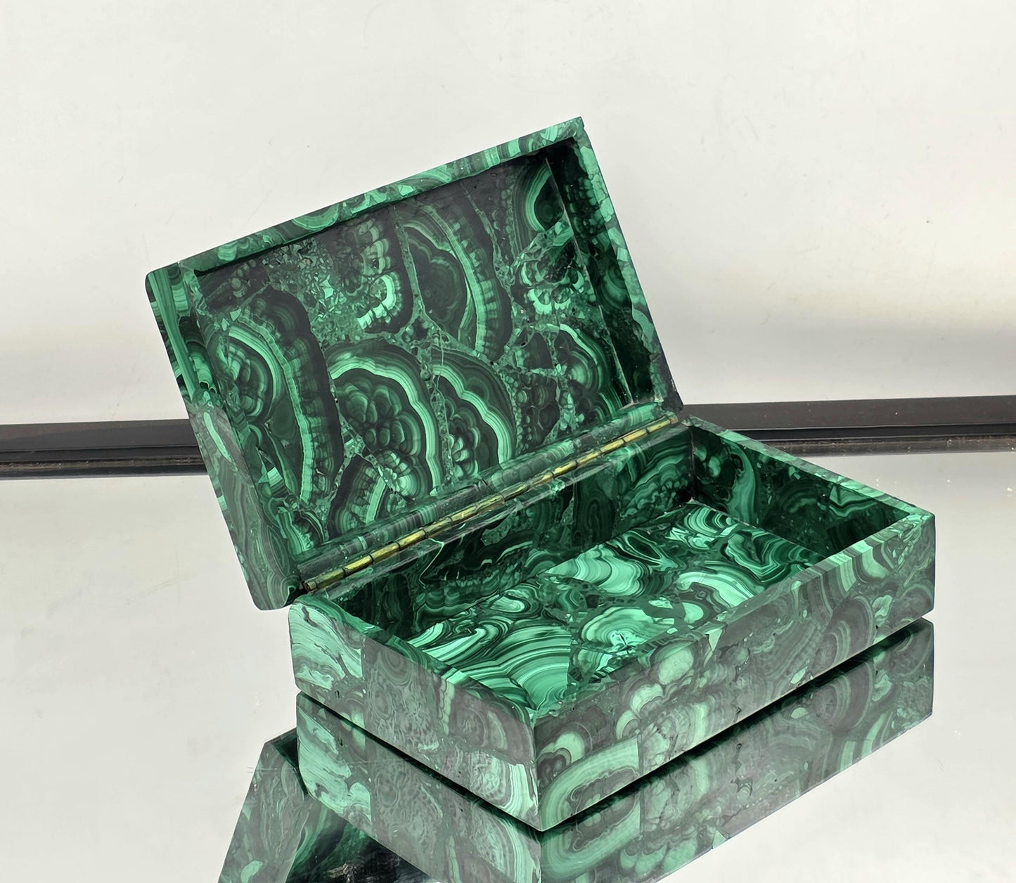 A luxurious Malachite jewellery box, an elegant décor piece.