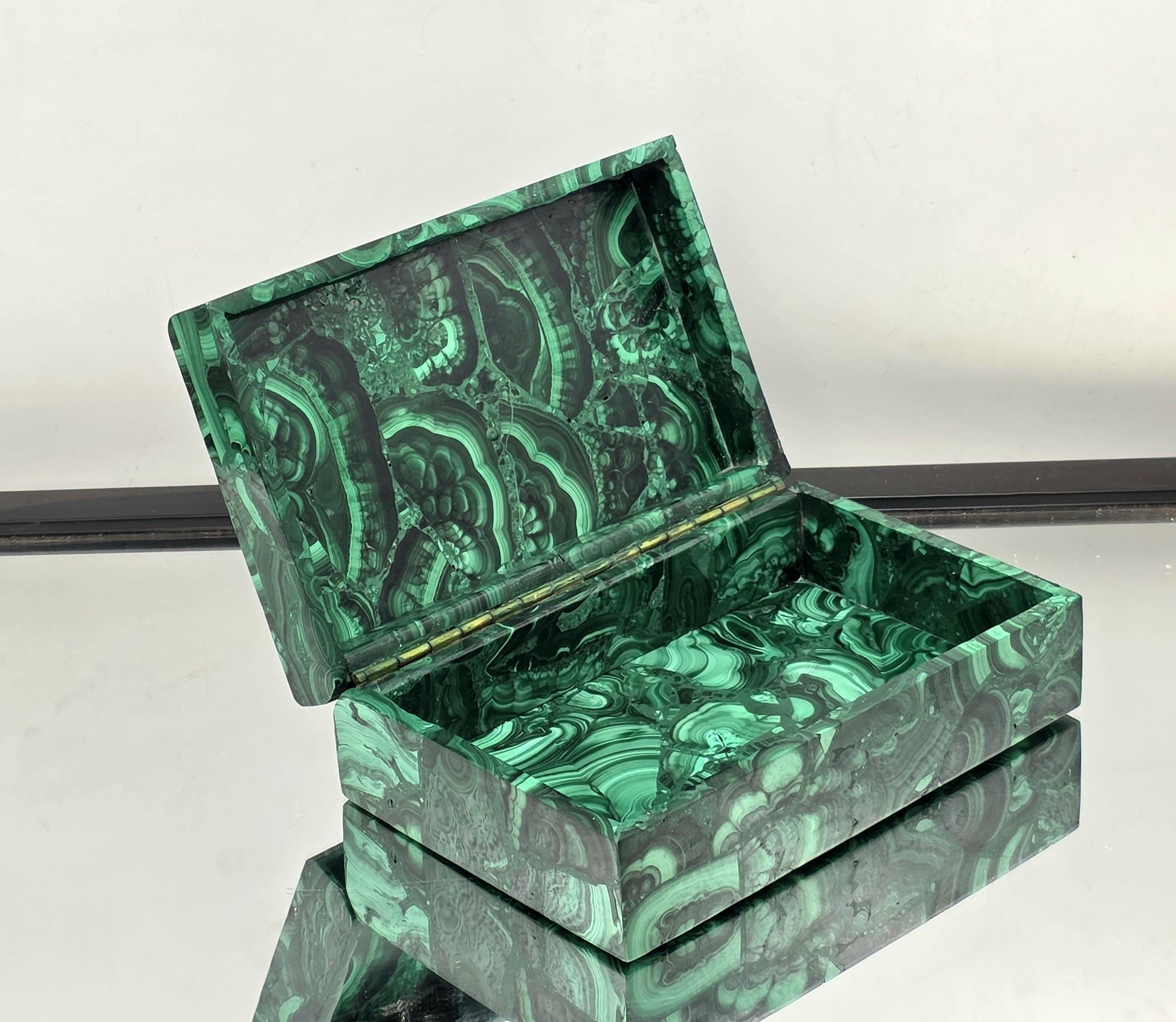 A luxurious Malachite jewellery box, an elegant décor piece.