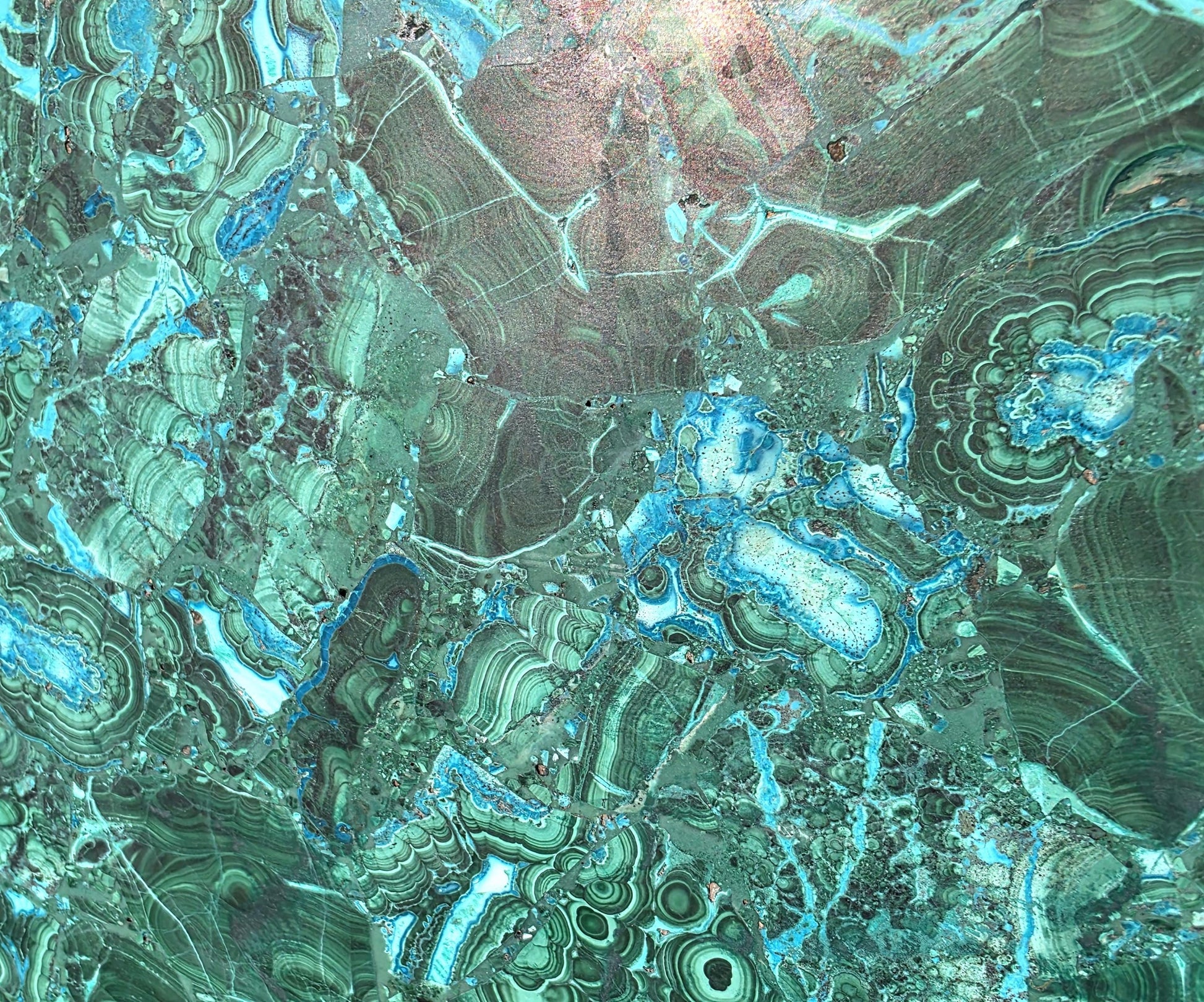 Luxury Malachite and Chrysocolla gemstone table for interior display.