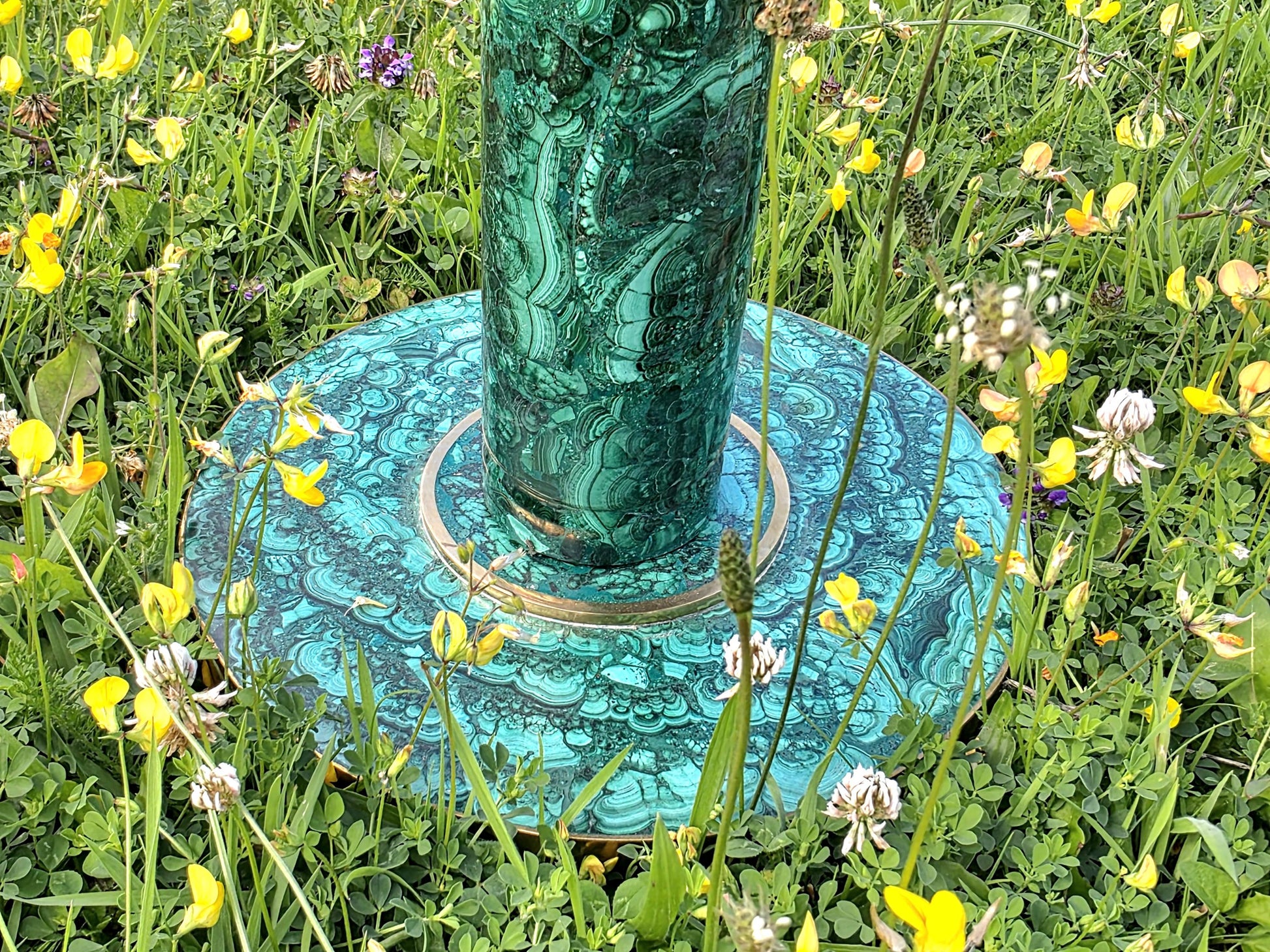 Luxury gemstone table featuring seamless malachite veneer and polished design elements.