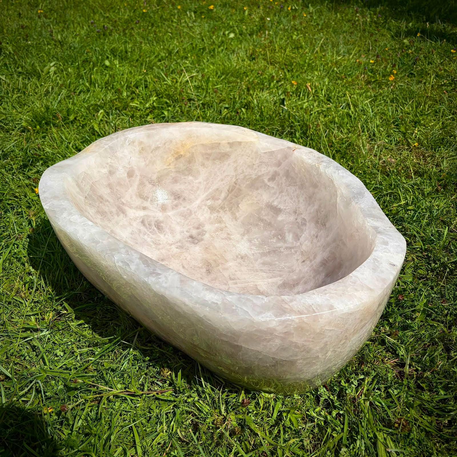 Full view of a 52kg Madagascan Quartz bowl with a broad hand-carved polished profile.