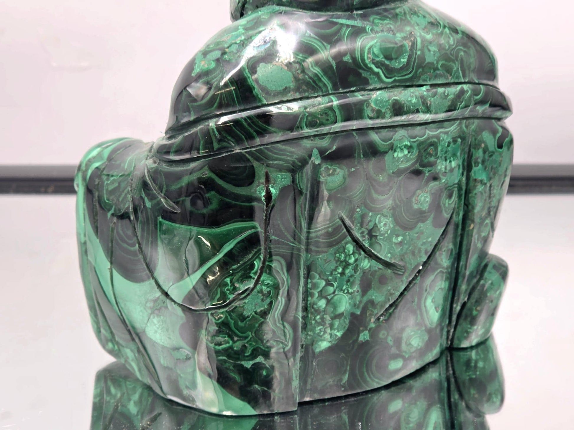 Luxury Malachite Buddha sculpture, handcrafted from premium gemstone, adding harmony and beauty to any space.