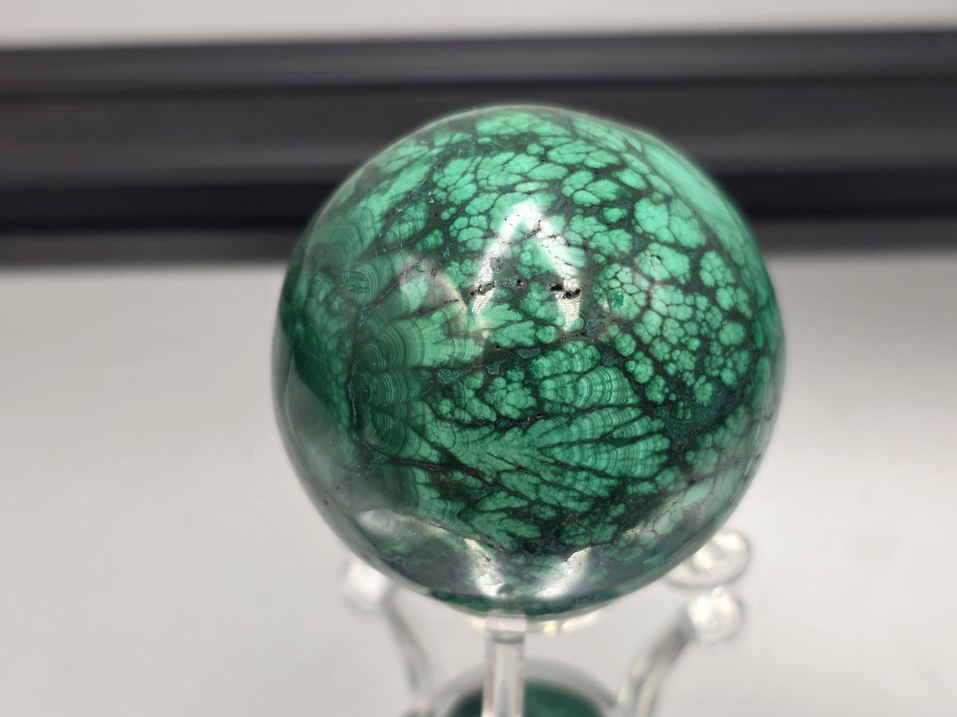 Luxury green crystal orb crafted from malachite.