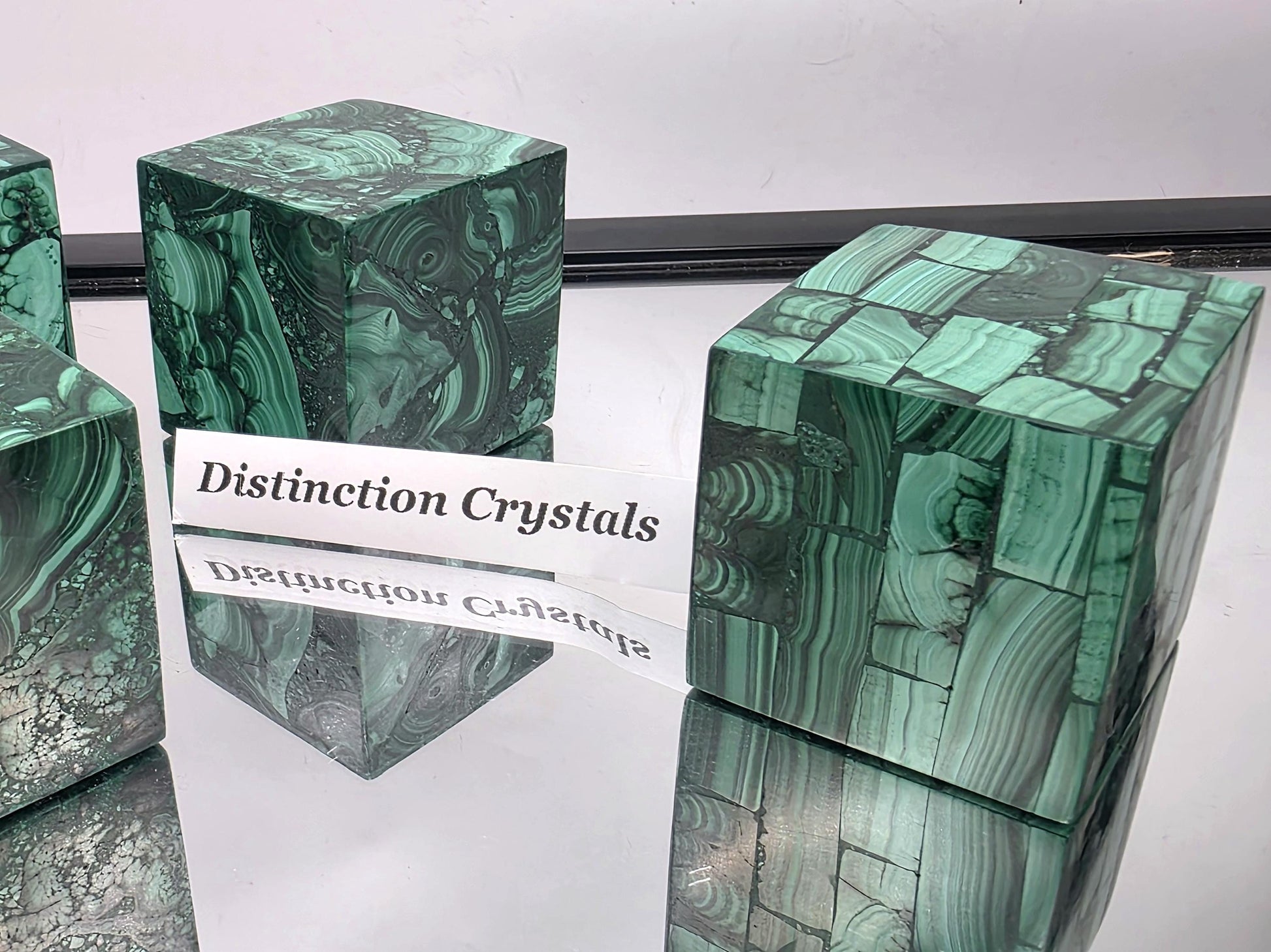 Malachite cube with other crystal décor pieces.