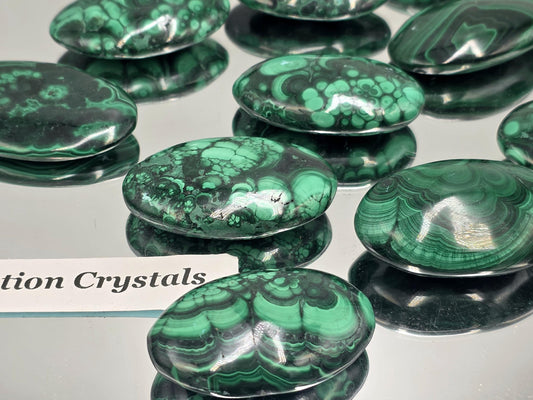 Hand-polished Malachite palmstone for collectors and décor.