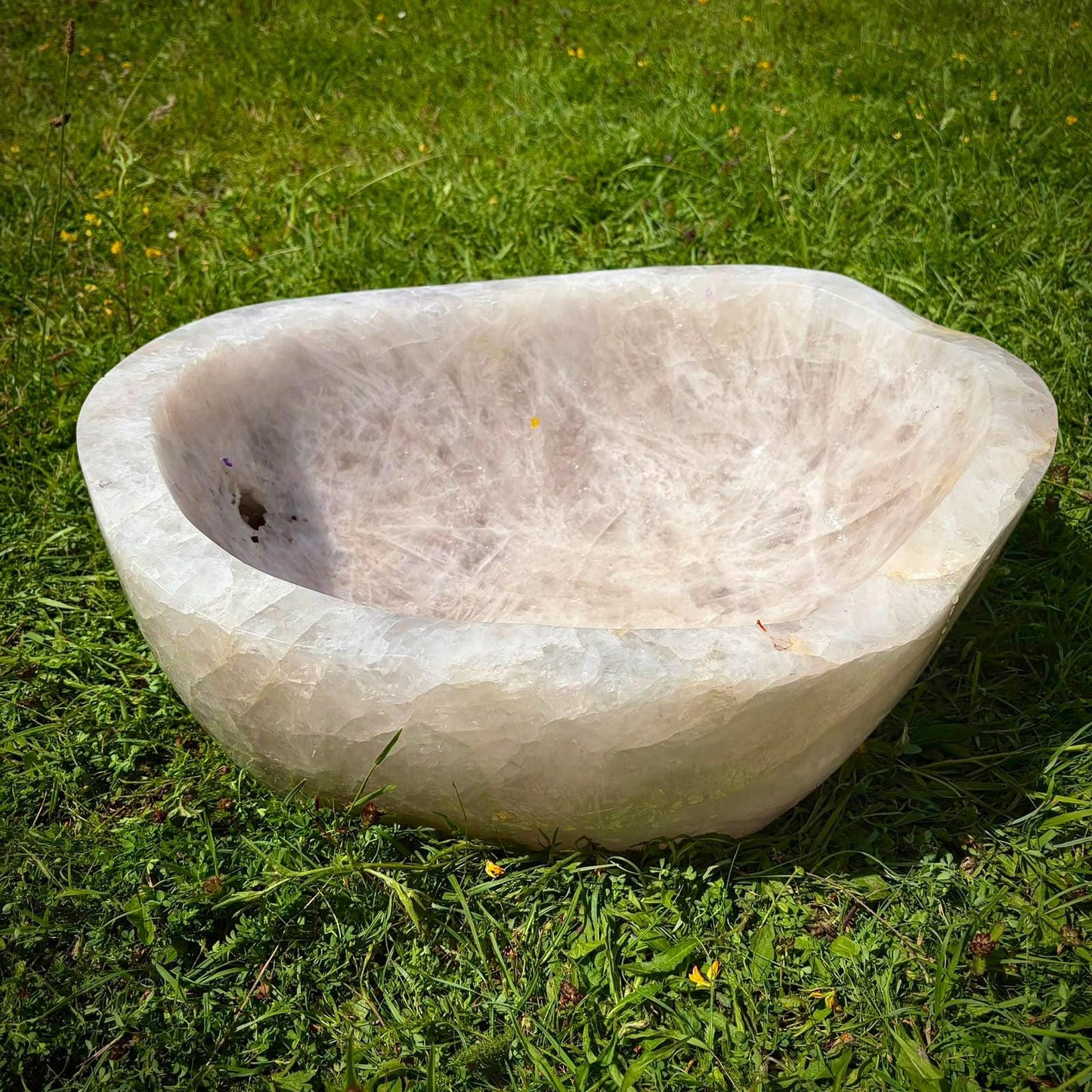 Large natural stone bowl with polished Quartz finish for elevated home décor.