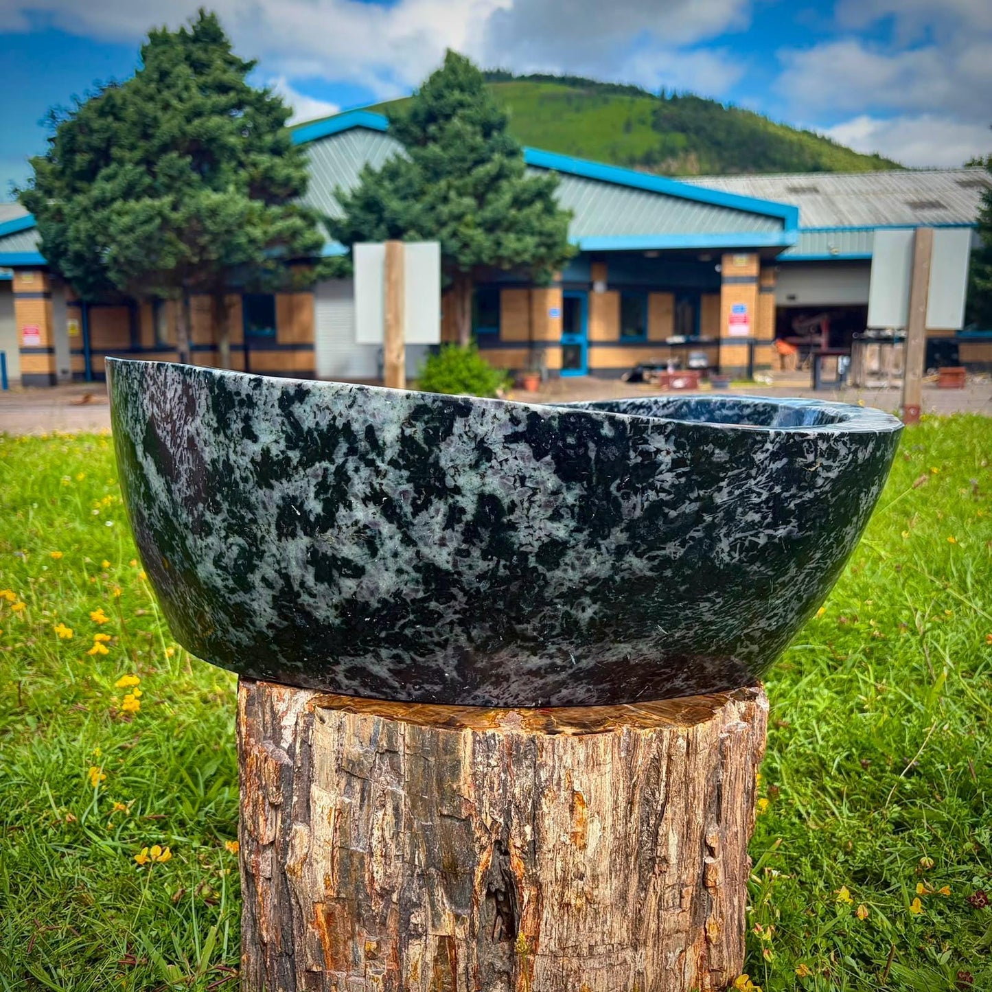 Madagascan polished stone bowl with deep indigo patterning for elevated interior styling.