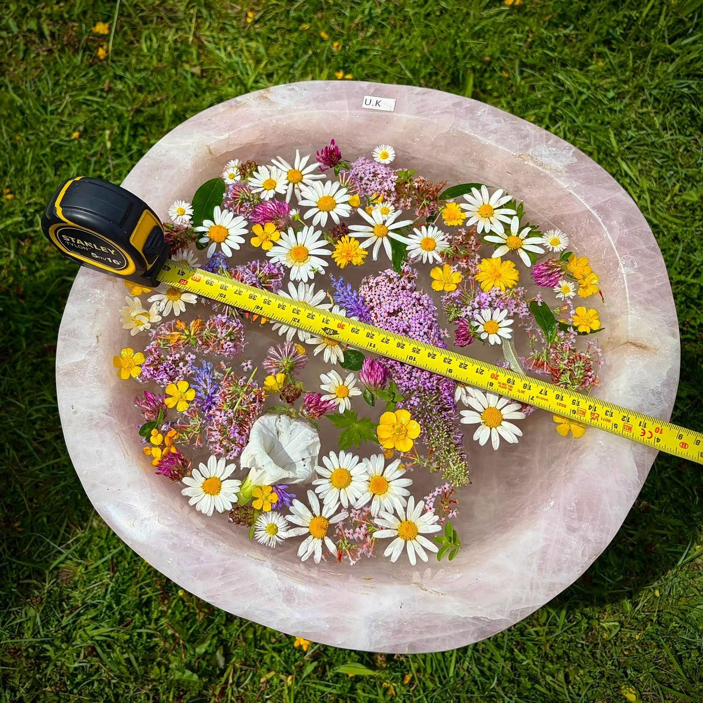 Sculptural Madagascan Rose Quartz bowl with a broad polished form and natural mineral character.