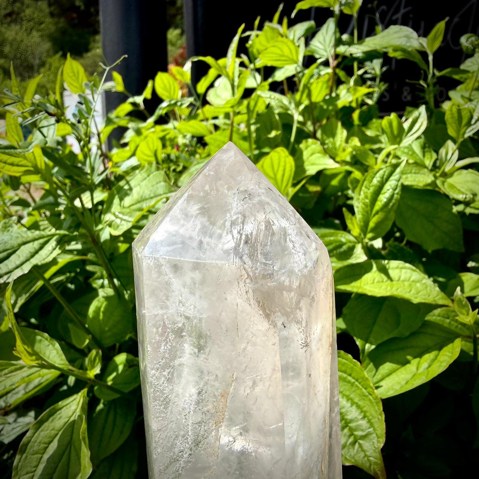 Madagascar clear quartz polished prism with natural inclusions and elegant display shape.