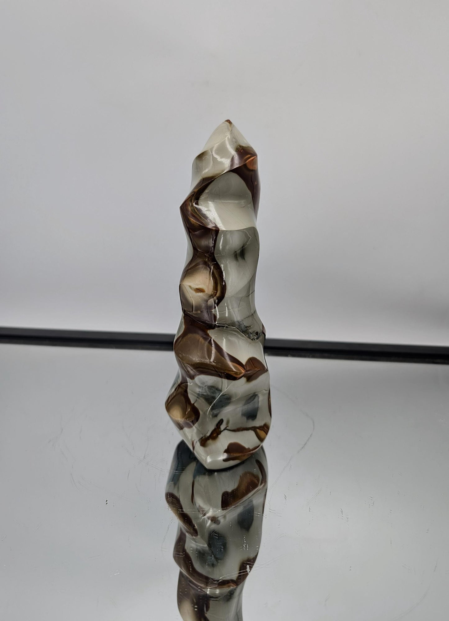 Stunning Polychrome Jasper Crystal Flame for unique decor, featuring vibrant hues.