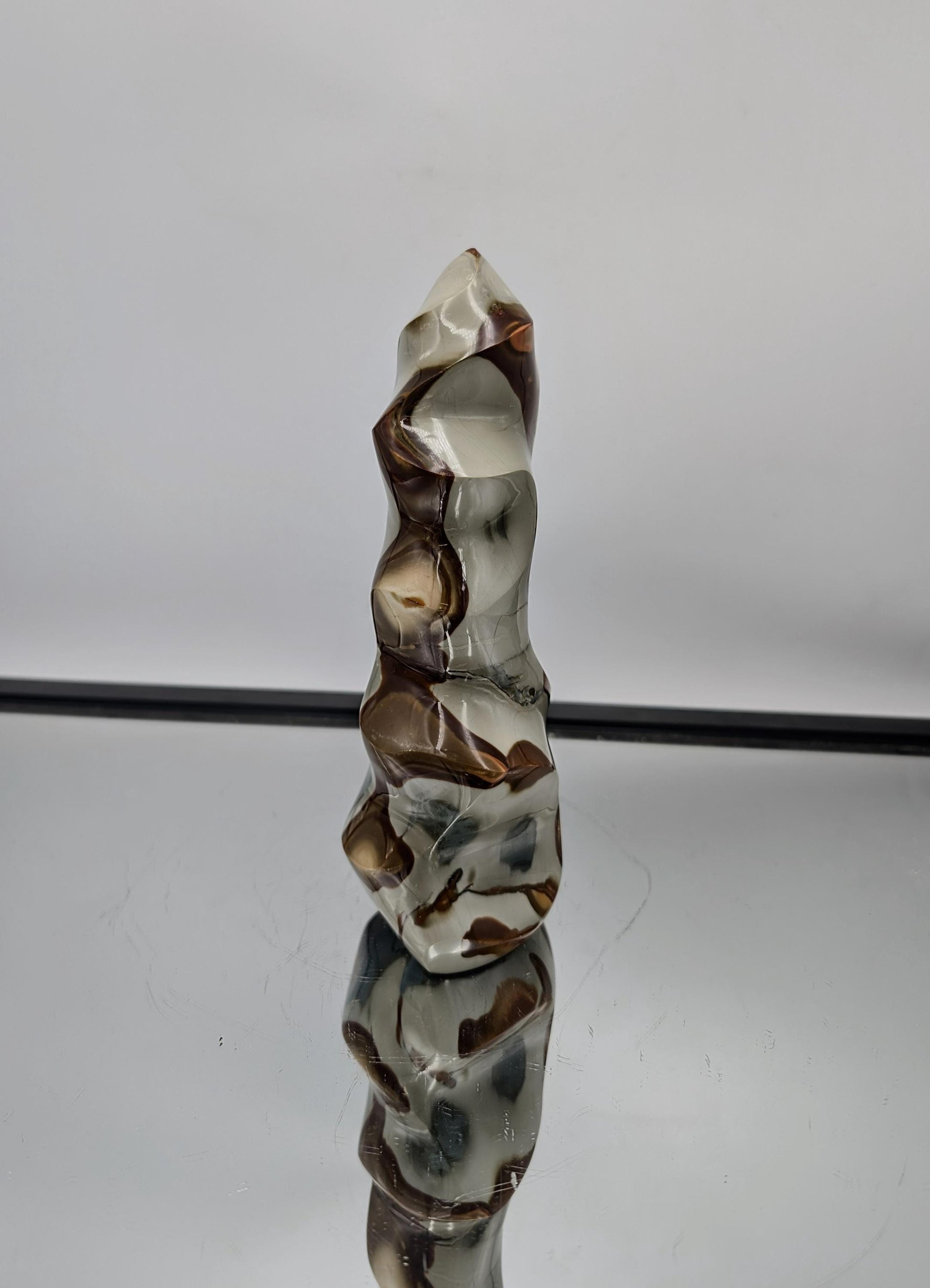 Stunning Polychrome Jasper Crystal Flame for unique decor, featuring vibrant hues.