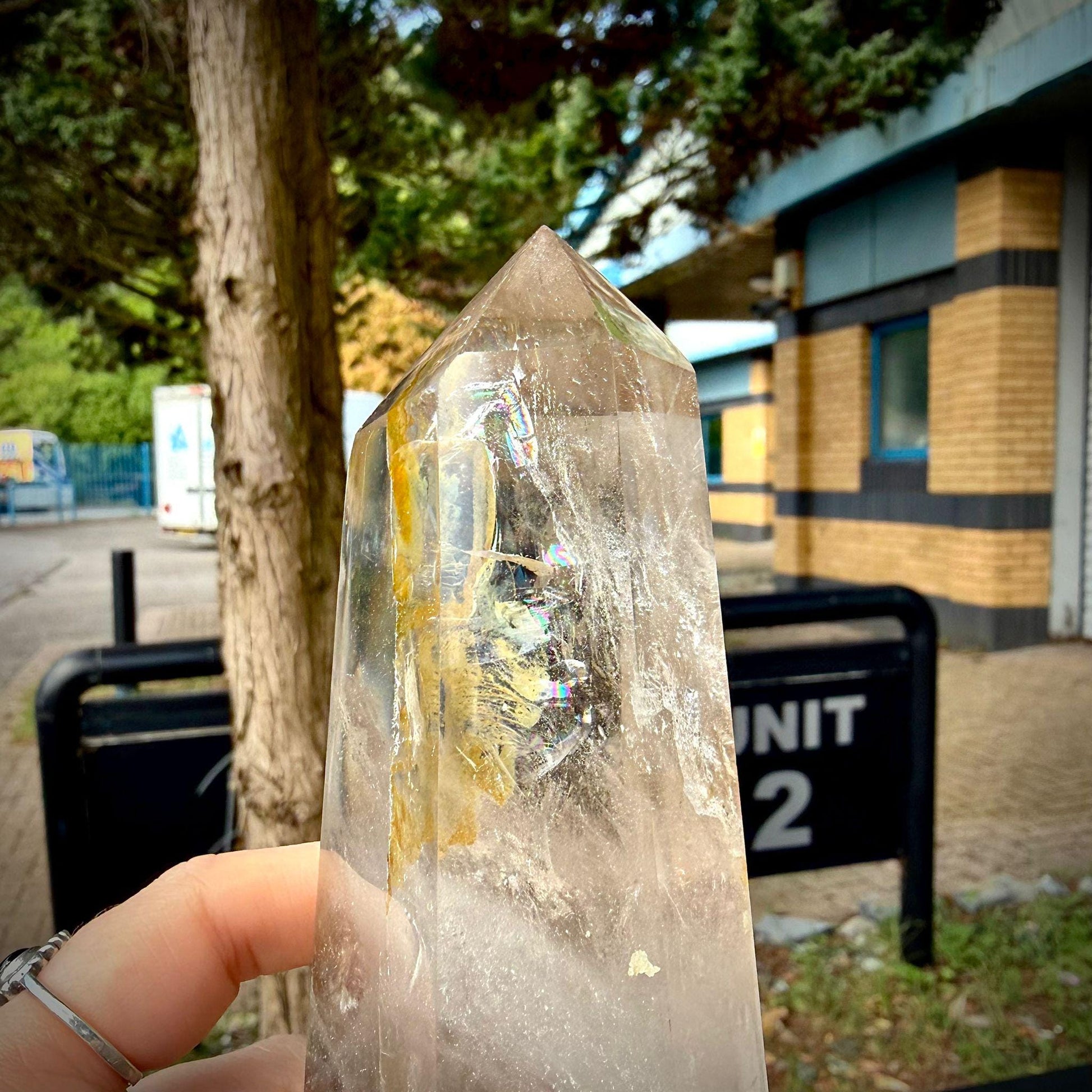 Hand polished Madagascar quartz tower displayed as a statement crystal decor piece.