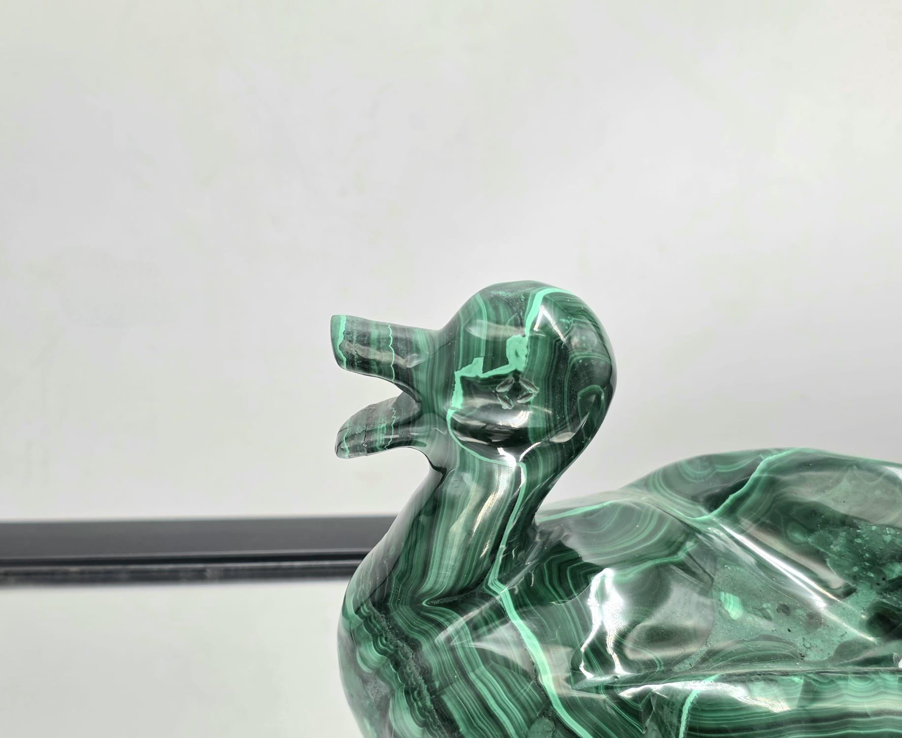 Close-up of detailed malachite animal carving