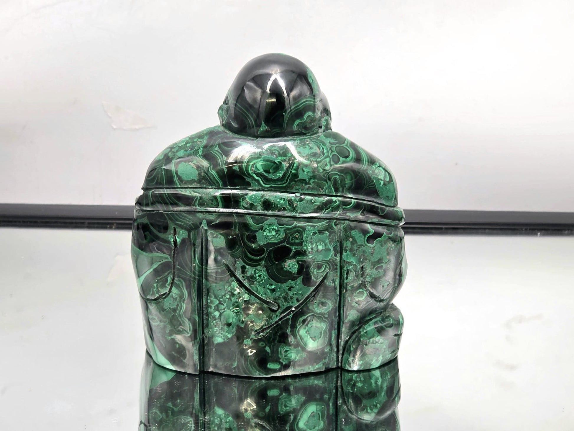 Decorative large Malachite Buddha carving — stunning natural gemstone décor for meditation rooms and crystal lovers.