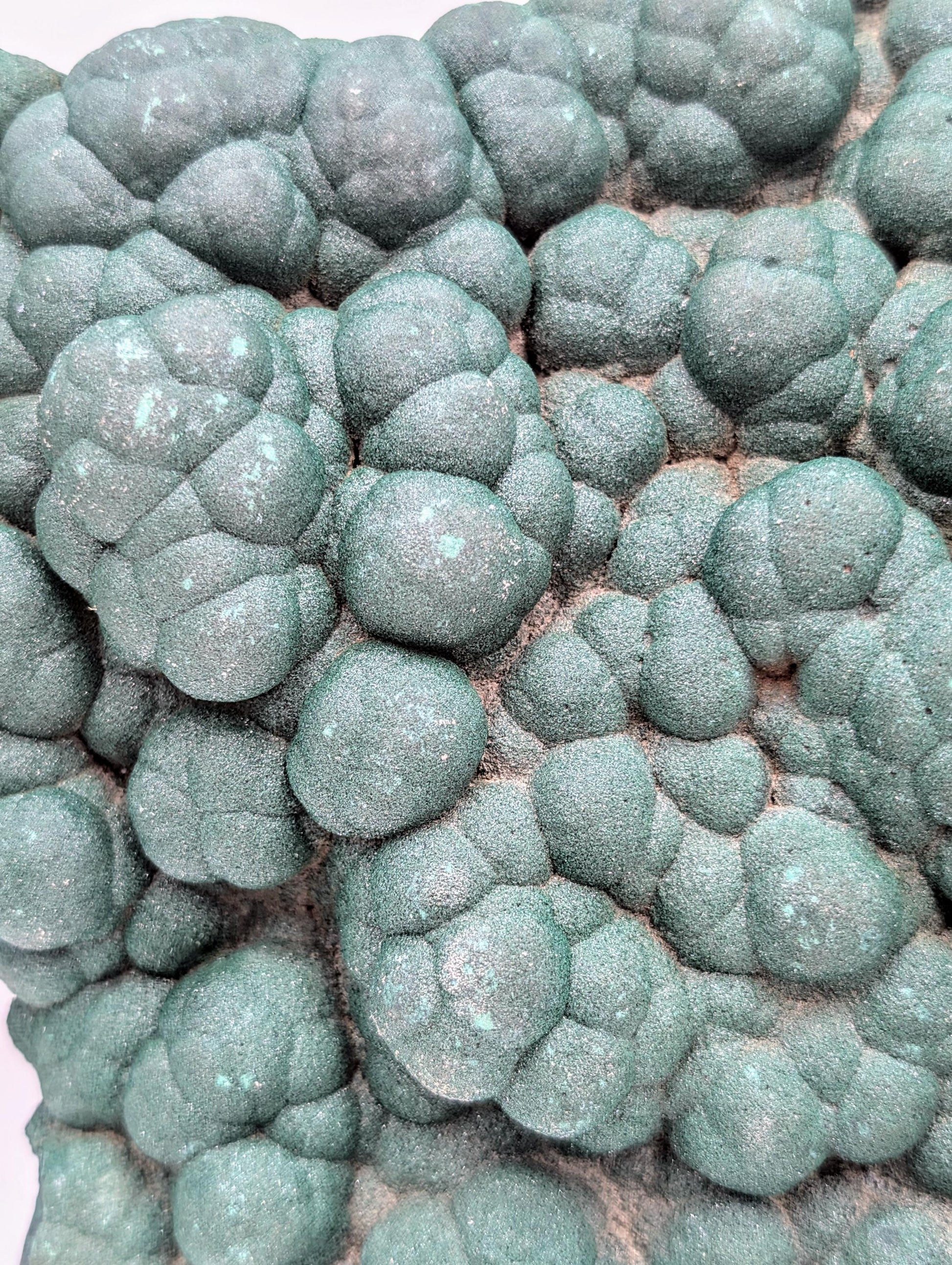 High-quality malachite crystal featuring natural quartz druzy.