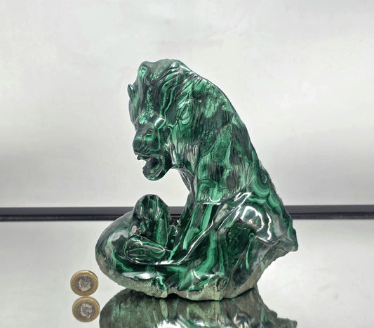 Front view of large Malachite lion carving.