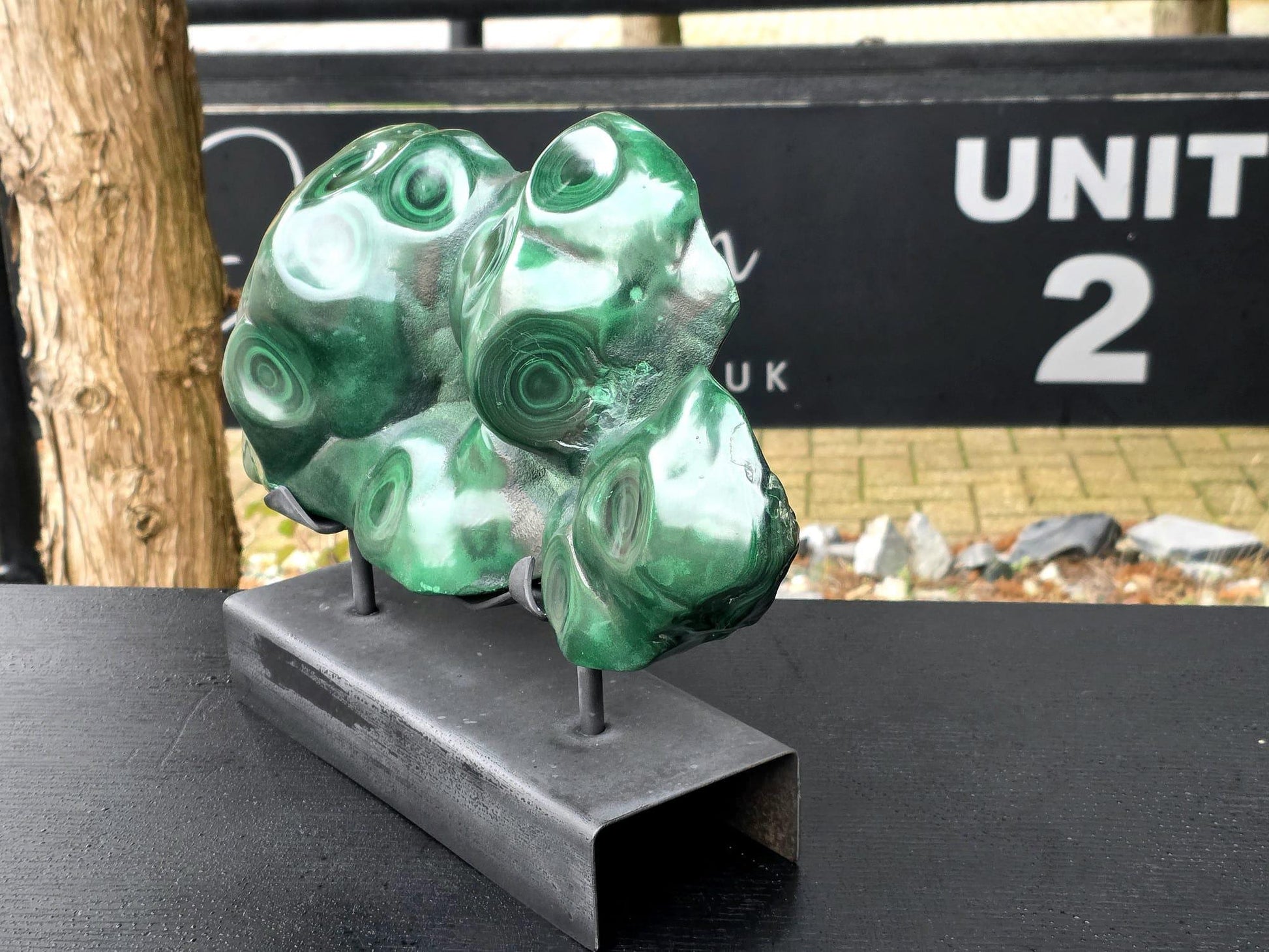 Malachite crystal freeform on stand, luxury collector mineral