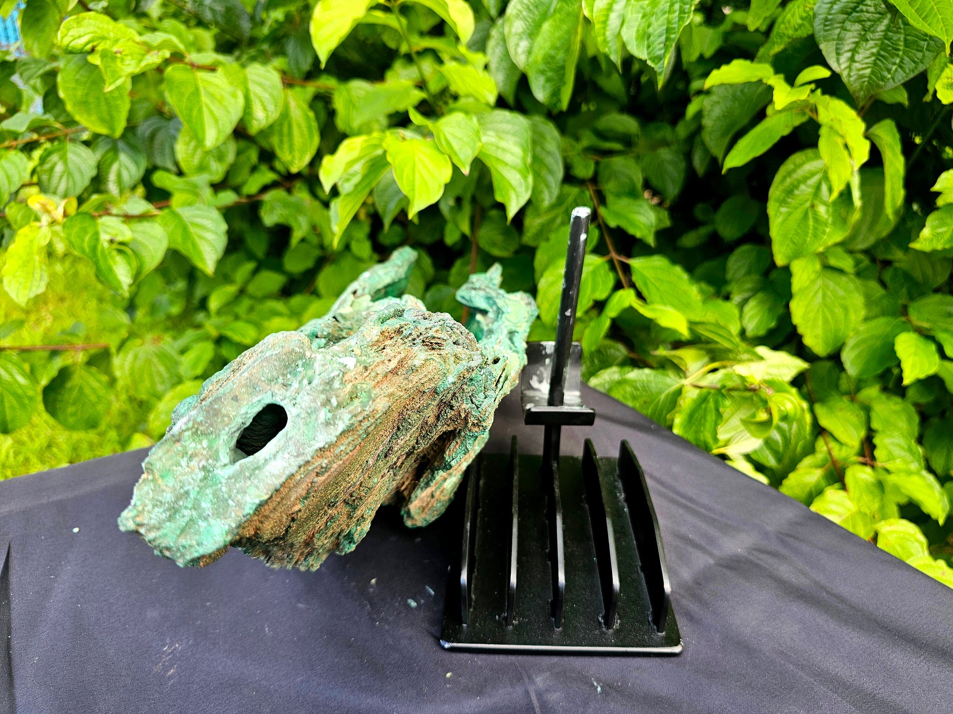 malachite crystal on stand