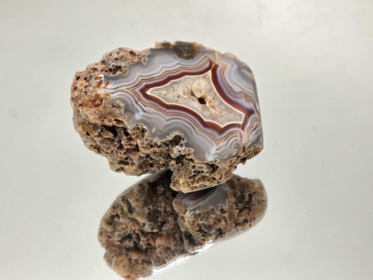 Malawi Agate geode with polished face and colour banding.