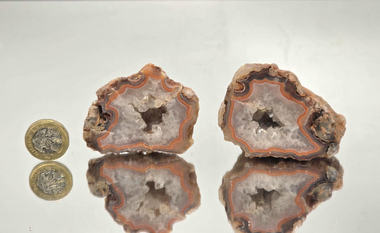 Malawi Agate geode pair with polished faces and banded layers.