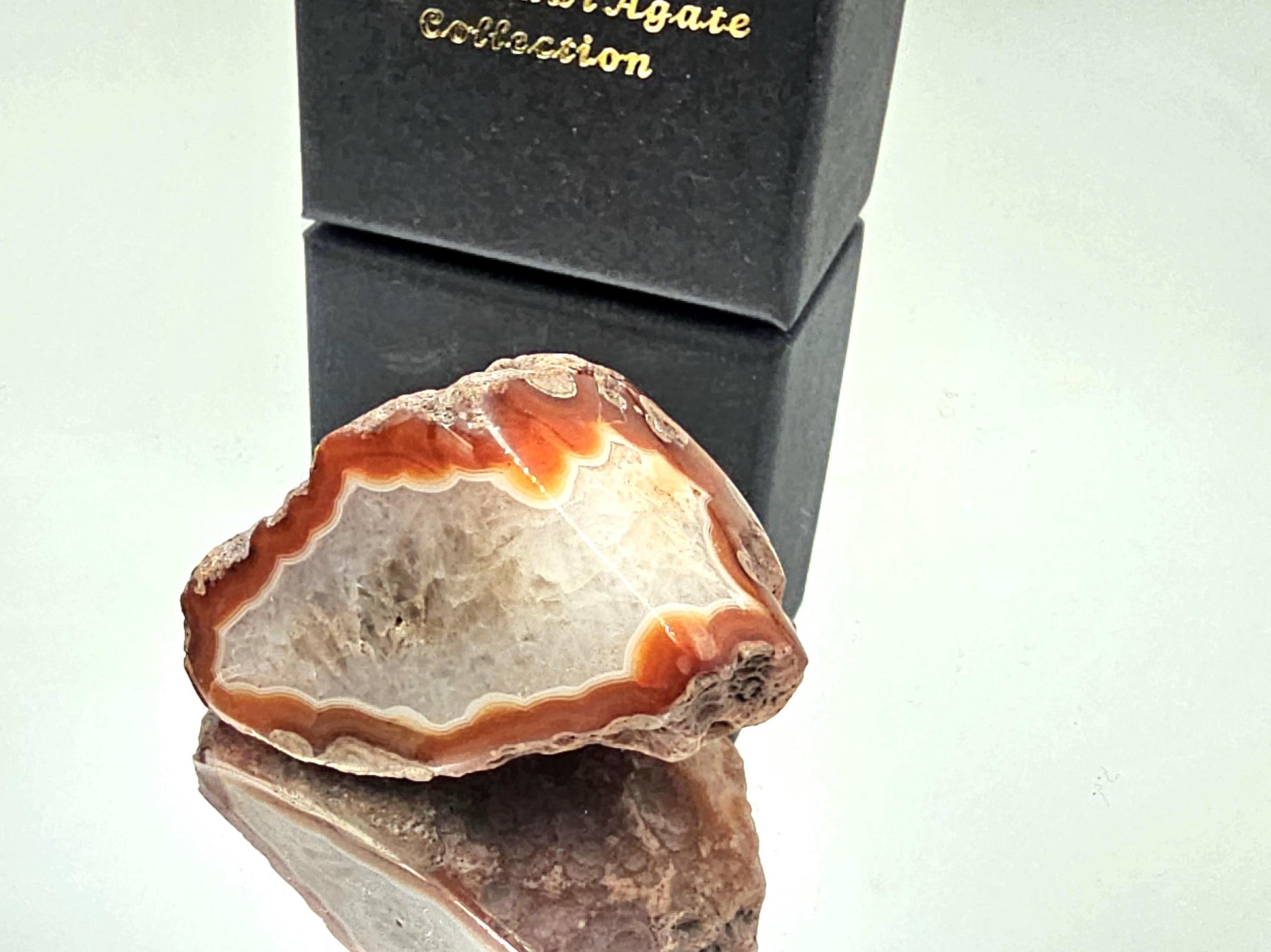 Natural Malawi agate crystal with exceptional color banding and a polished surface.