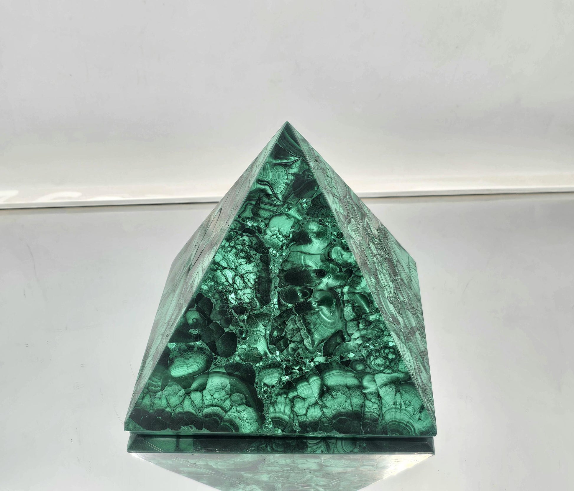 vibrant malachite pyramid in green tones, perfect for interior styling.