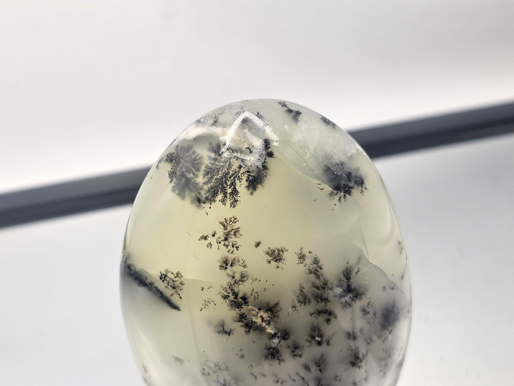 Merlinite with unique fern-like patterns in a polished stand-up form.