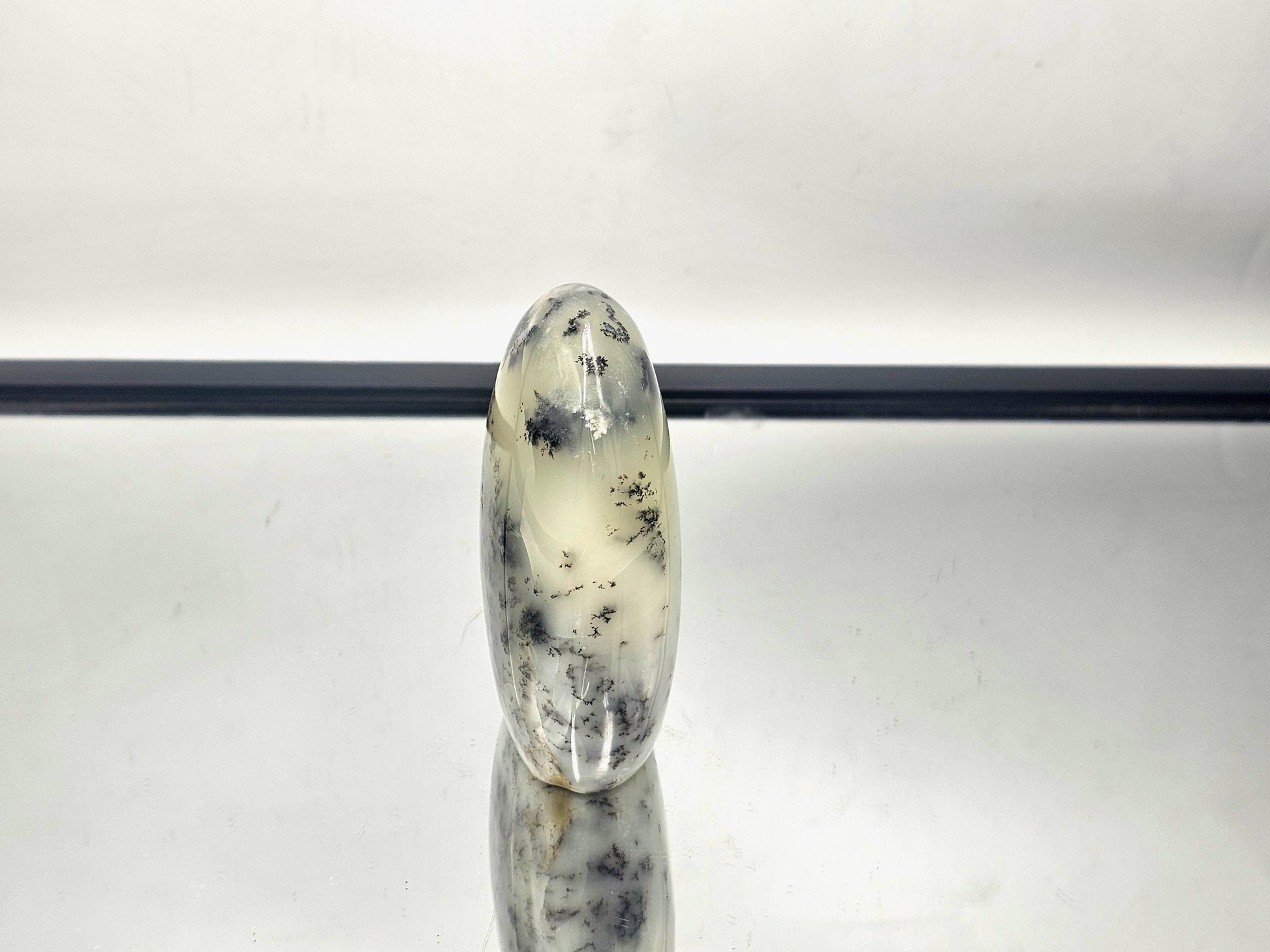 Merlinite Polished Stand-Up with fern-like patterns, sourced from Madagascar.