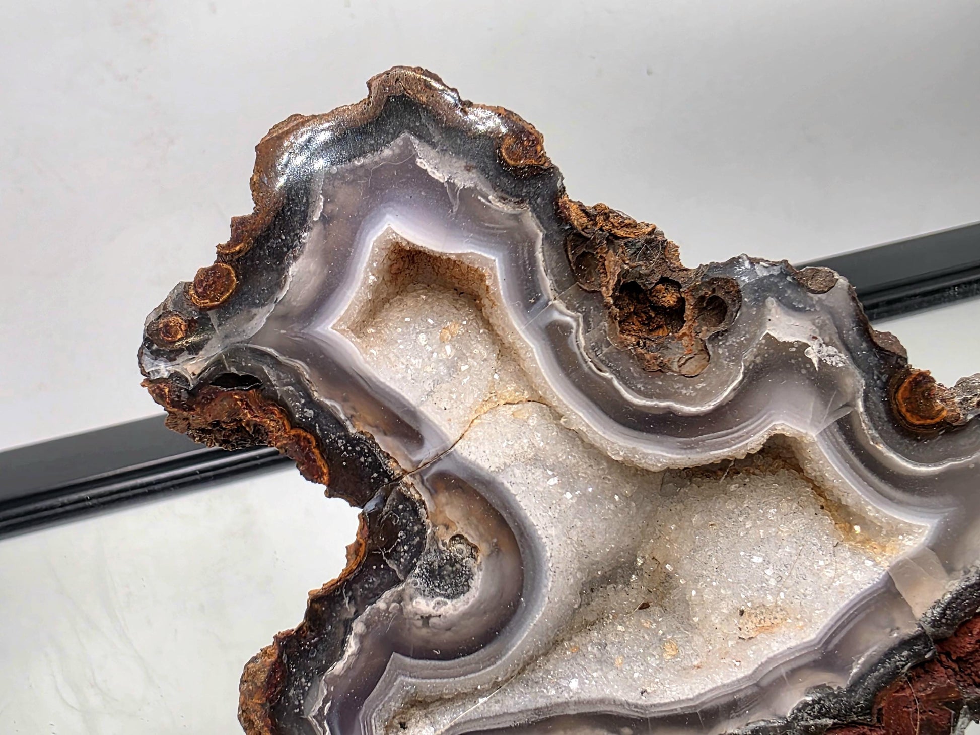 Polished Mexican Agate Geode gemstone suitable for display.