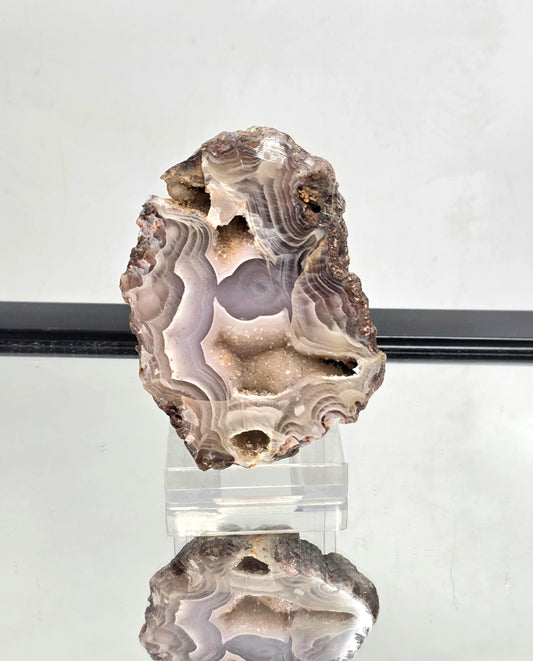 Mexican Agate Geode with polished edges and striking natural banding.