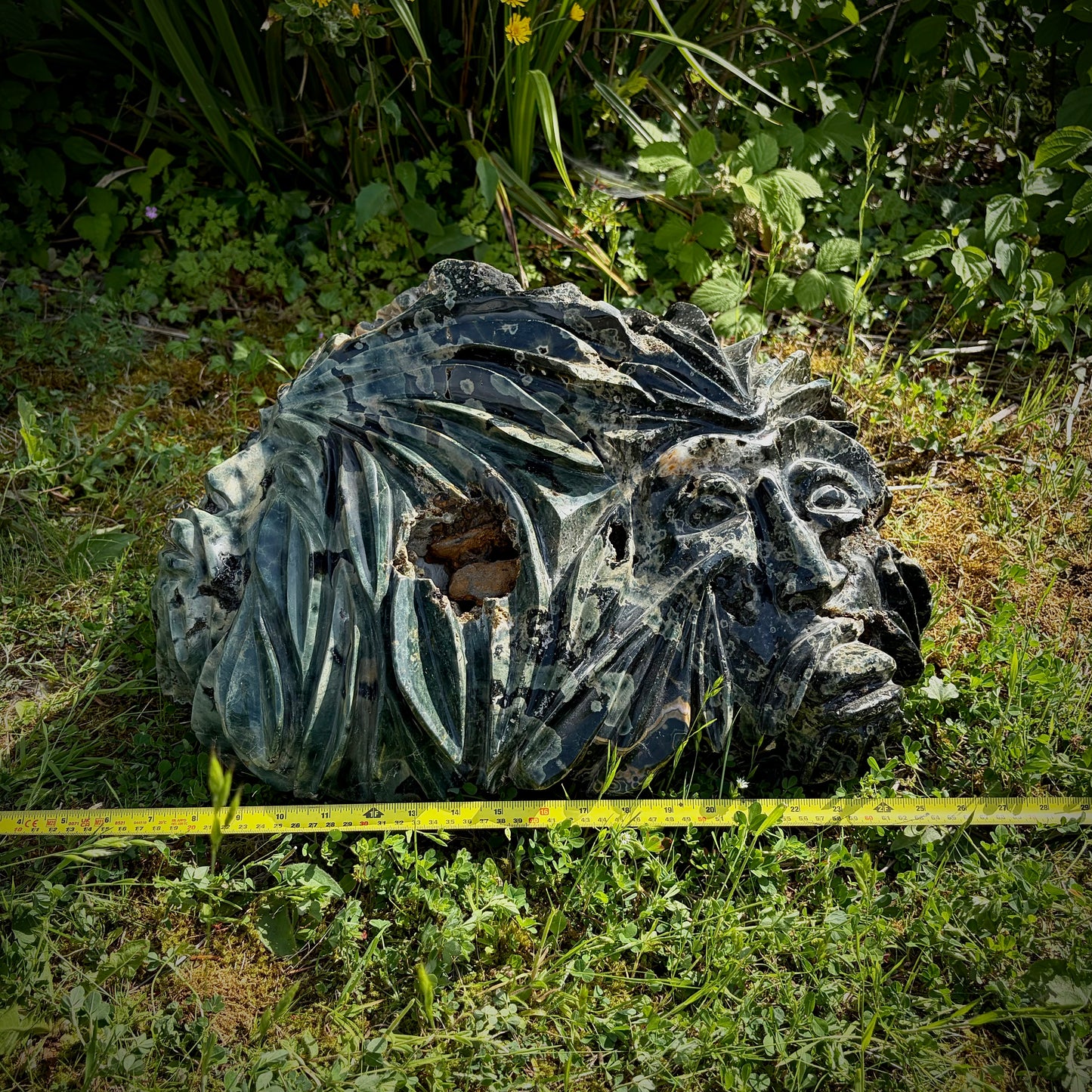 Mystical Green Man large crystal stone carving symbolising nature, growth and seasonal renewal