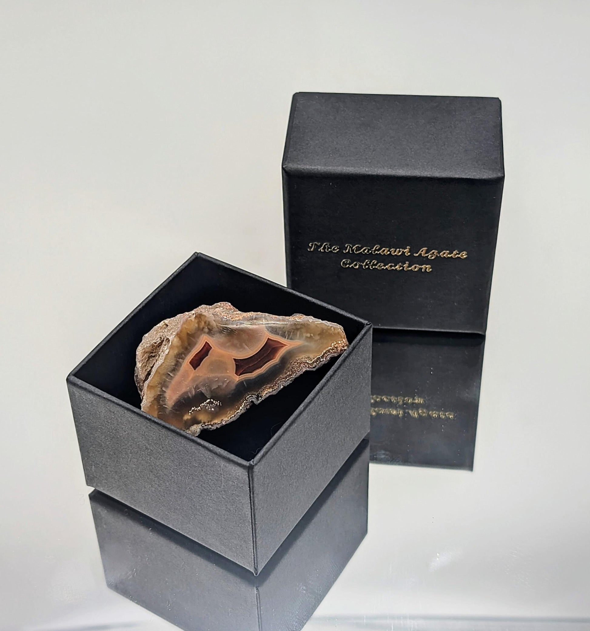 A natural banded agate collection from Malawi, featuring polished, high-quality stones.