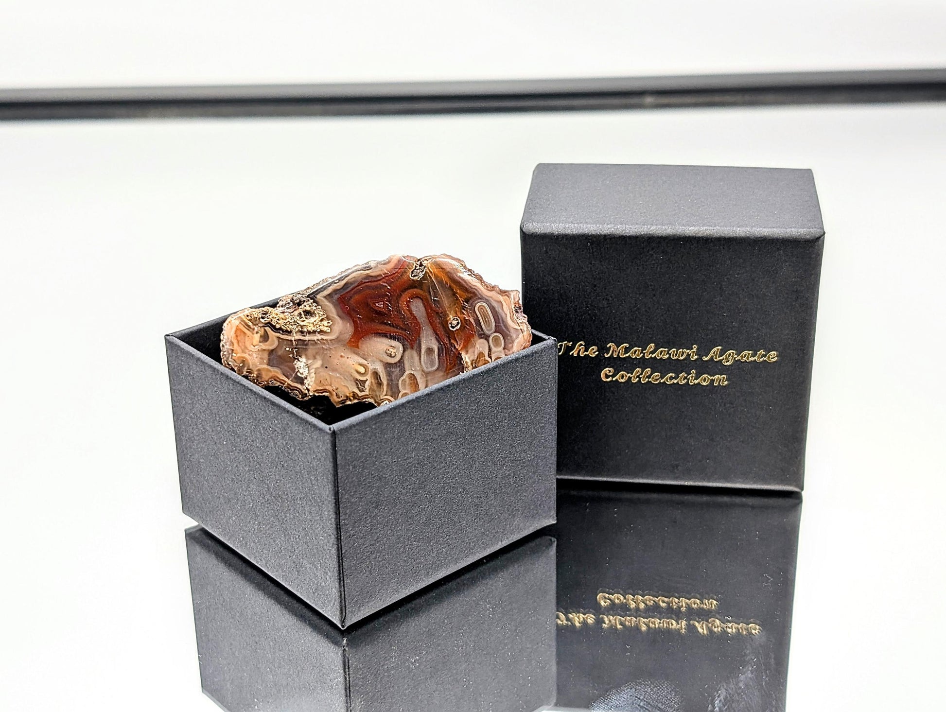 Exceptional natural banded agate from Malawi with rich hues and a smooth finish.