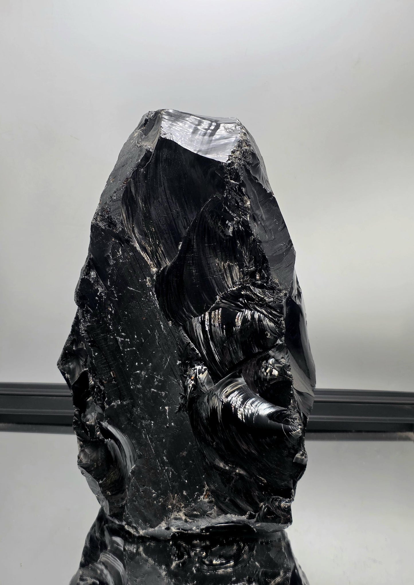 Raw volcanic obsidian with rugged edges
