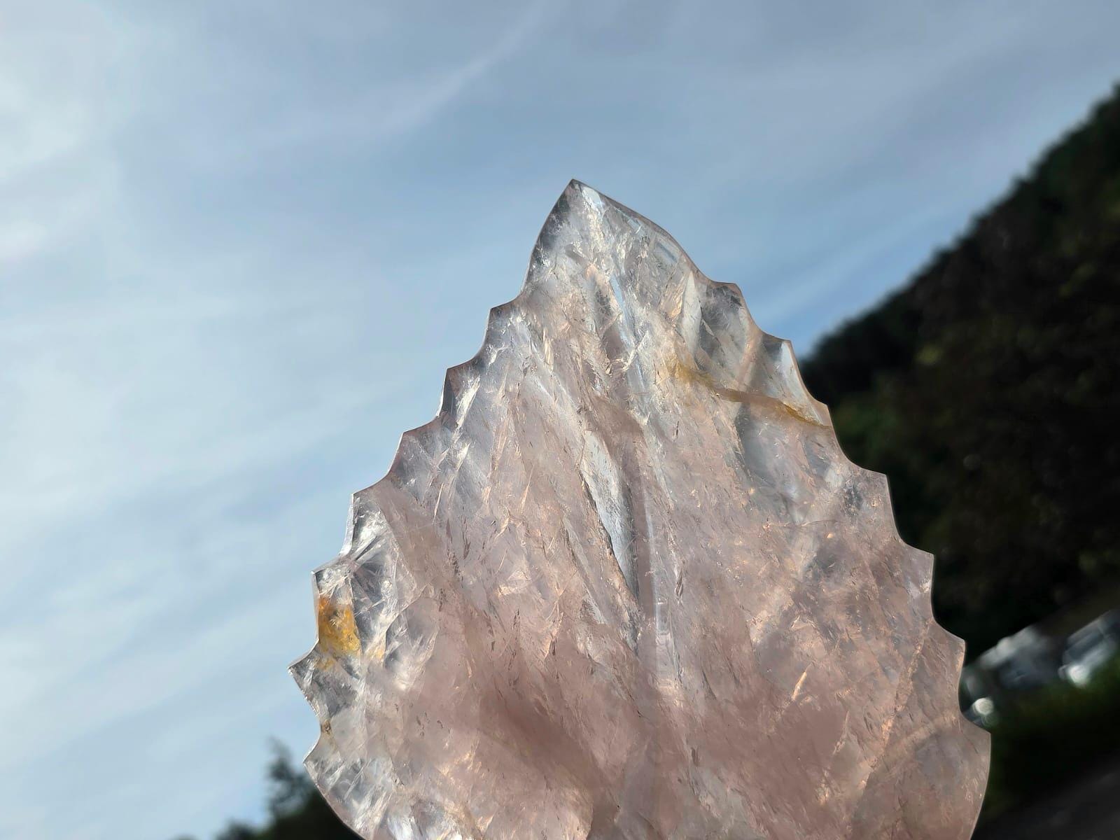 Genuine Rose Quartz leaf displaying natural crystal translucency.