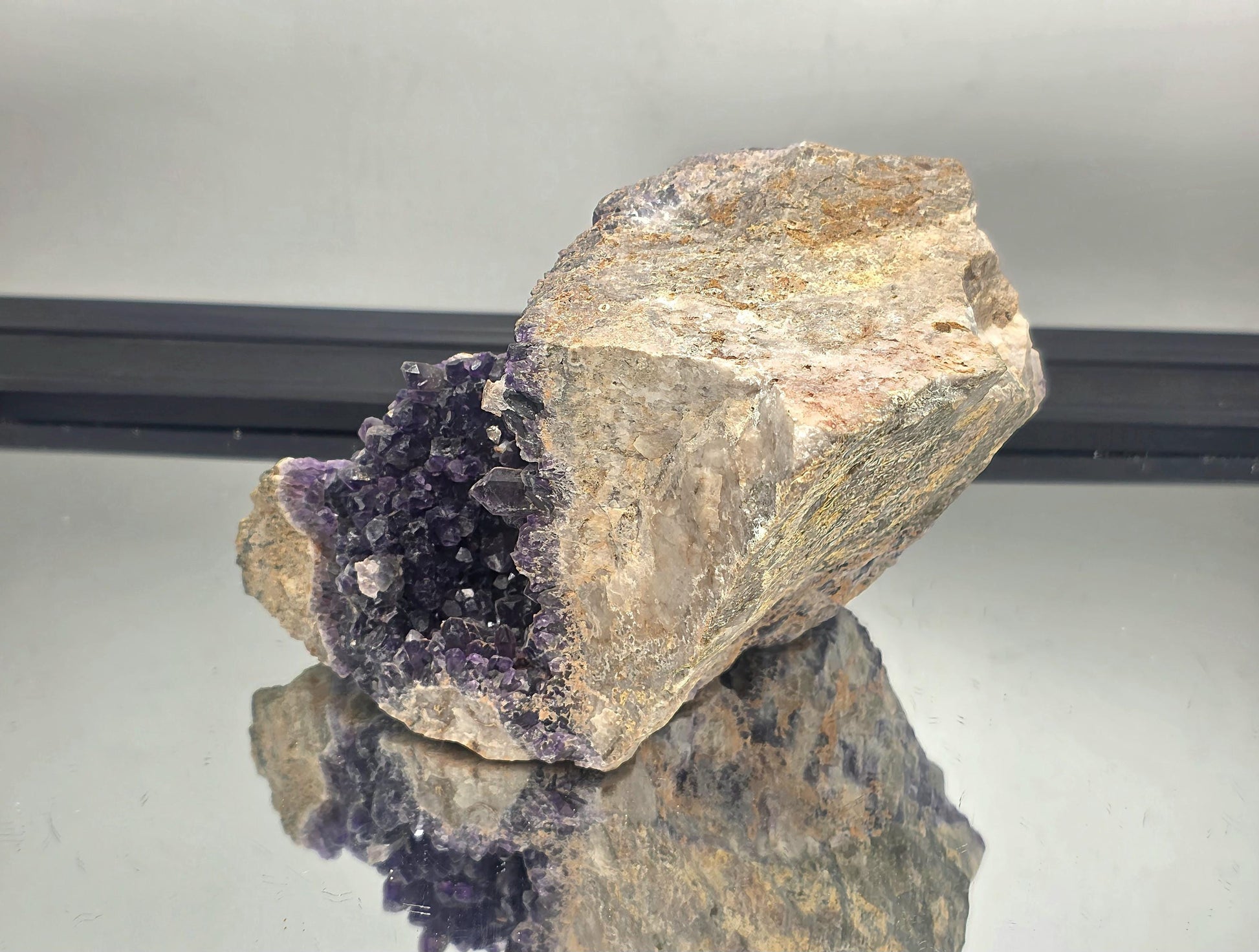 Natural Mapatizya amethyst cluster, dark purple crystal points.