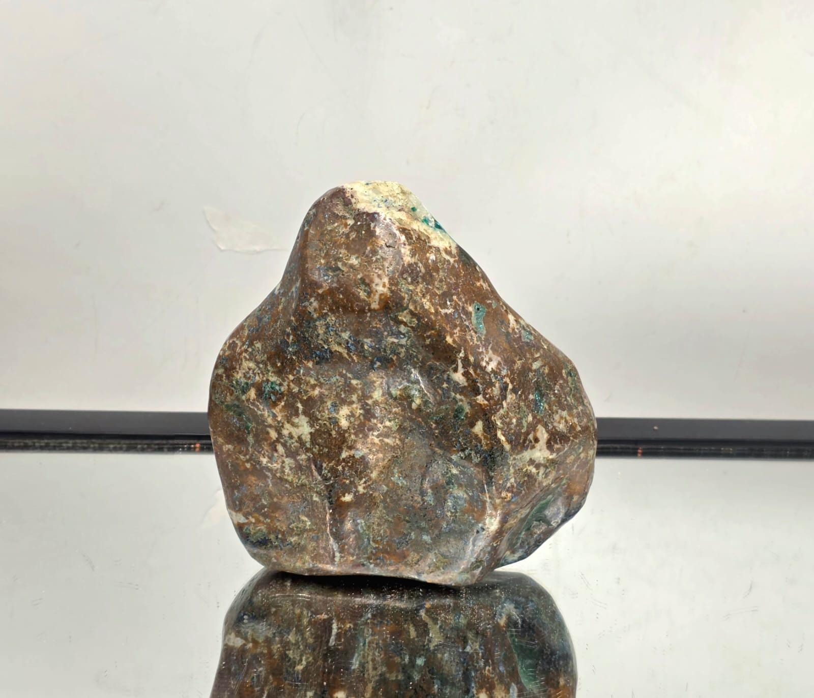 Natural dioptase crystal with polished face showing deep green colour