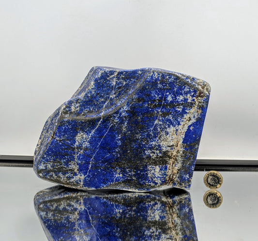 Display piece made from natural Lapis Lazuli in freeform shape.