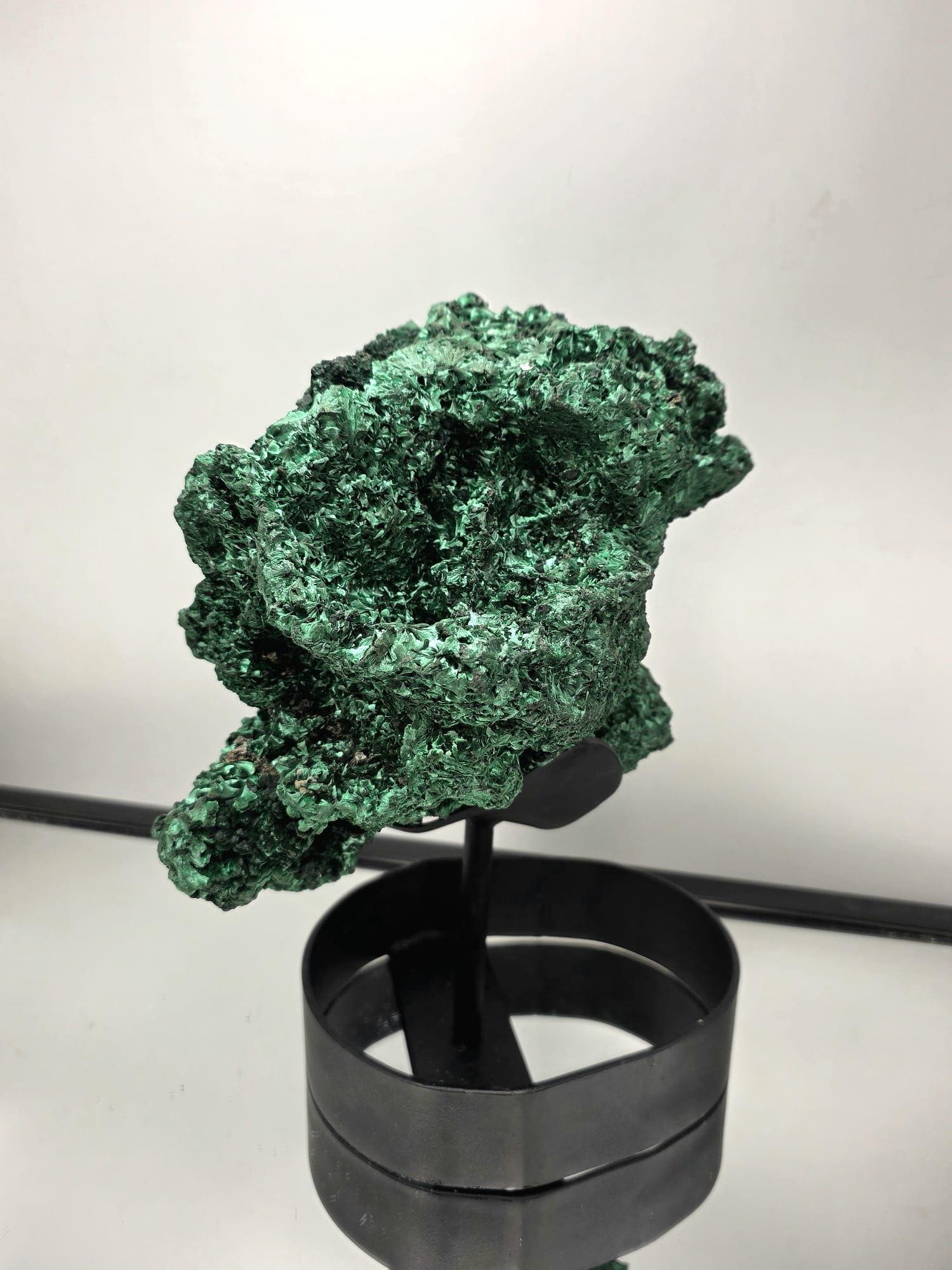 Natural Malachite art sculpture showcasing layered green tones