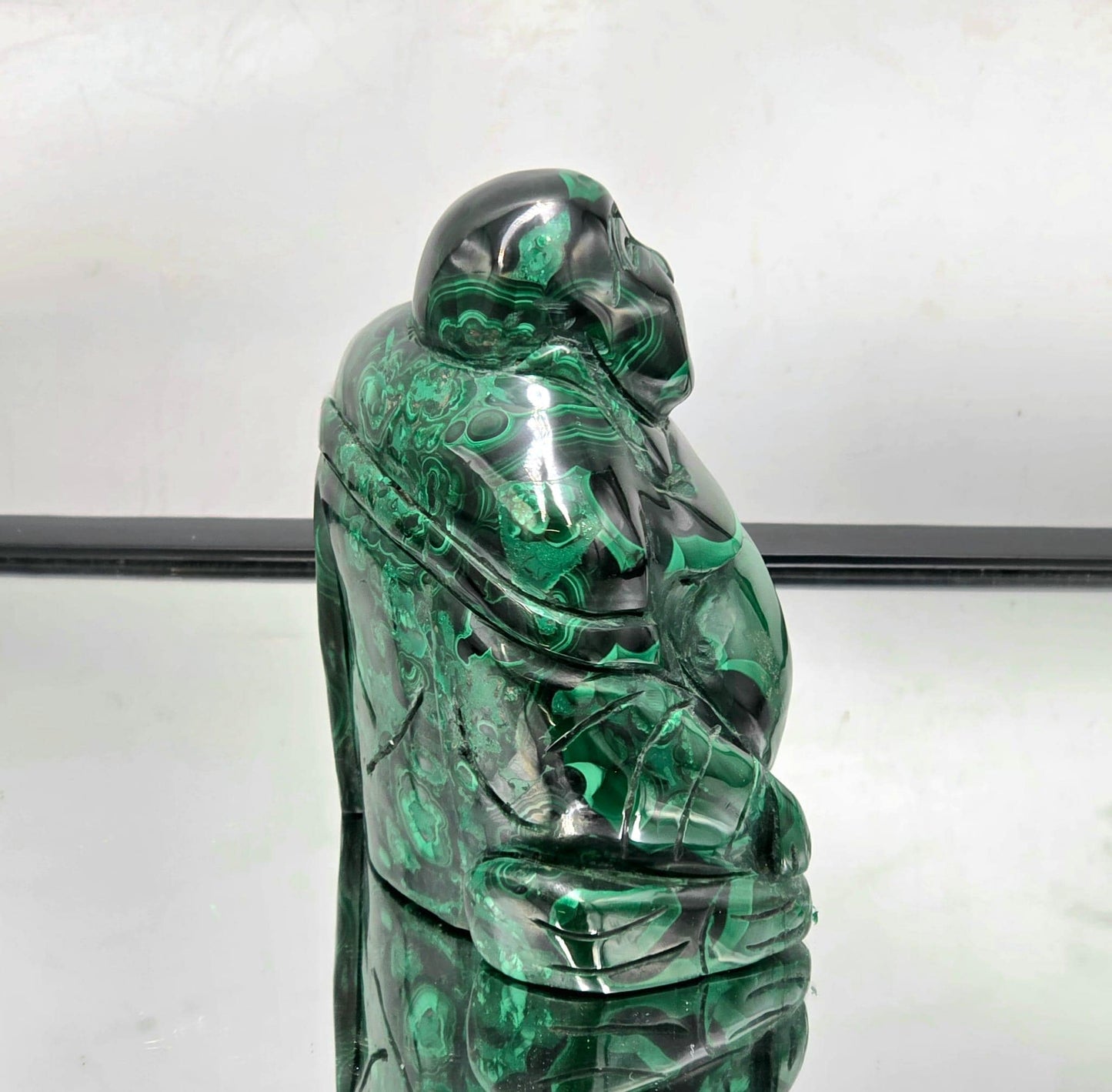 Natural Malachite Buddha crystal art piece combining spiritual symbolism with striking mineral beauty.