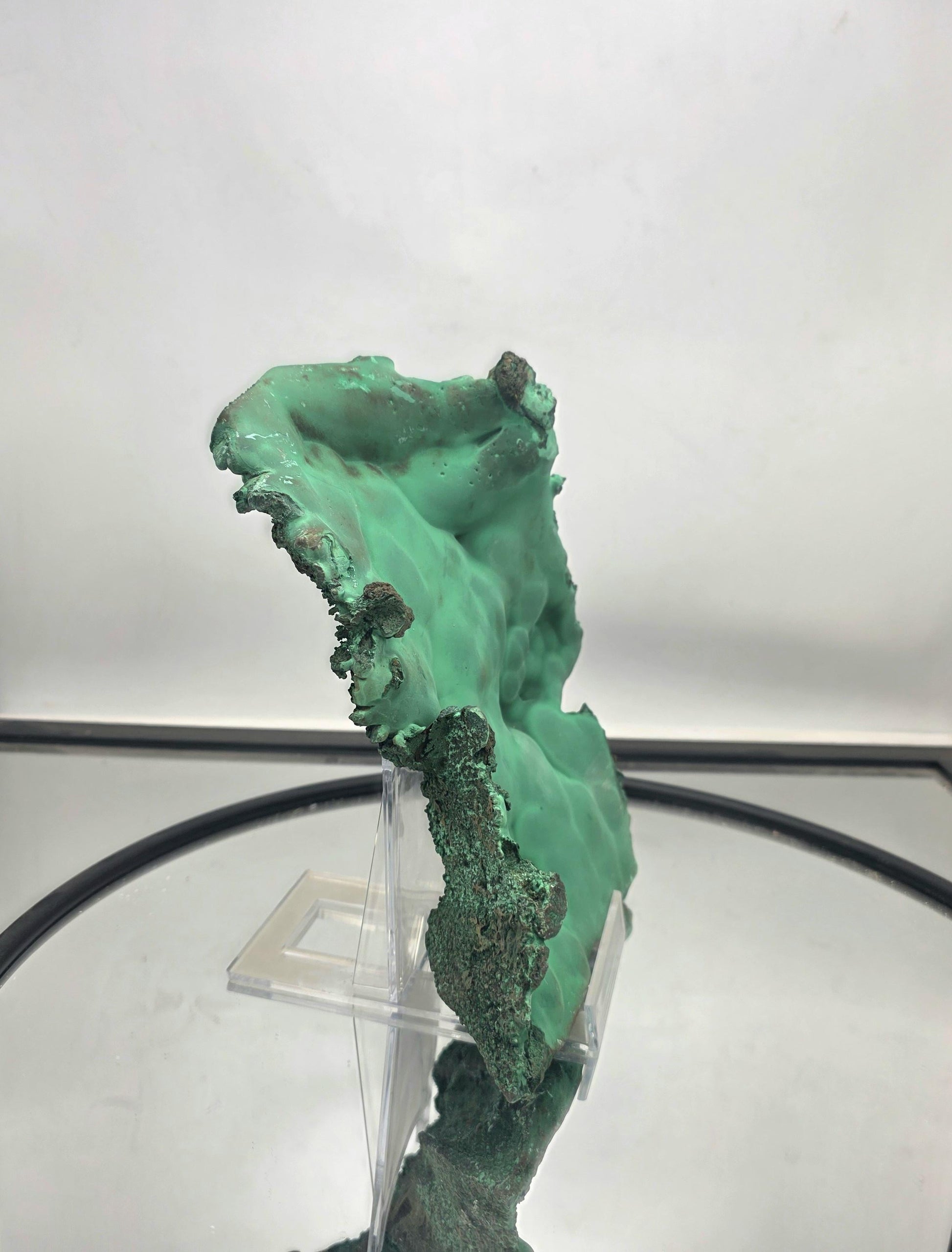 Raw malachite crystal plate with distinctive and rich coloration.