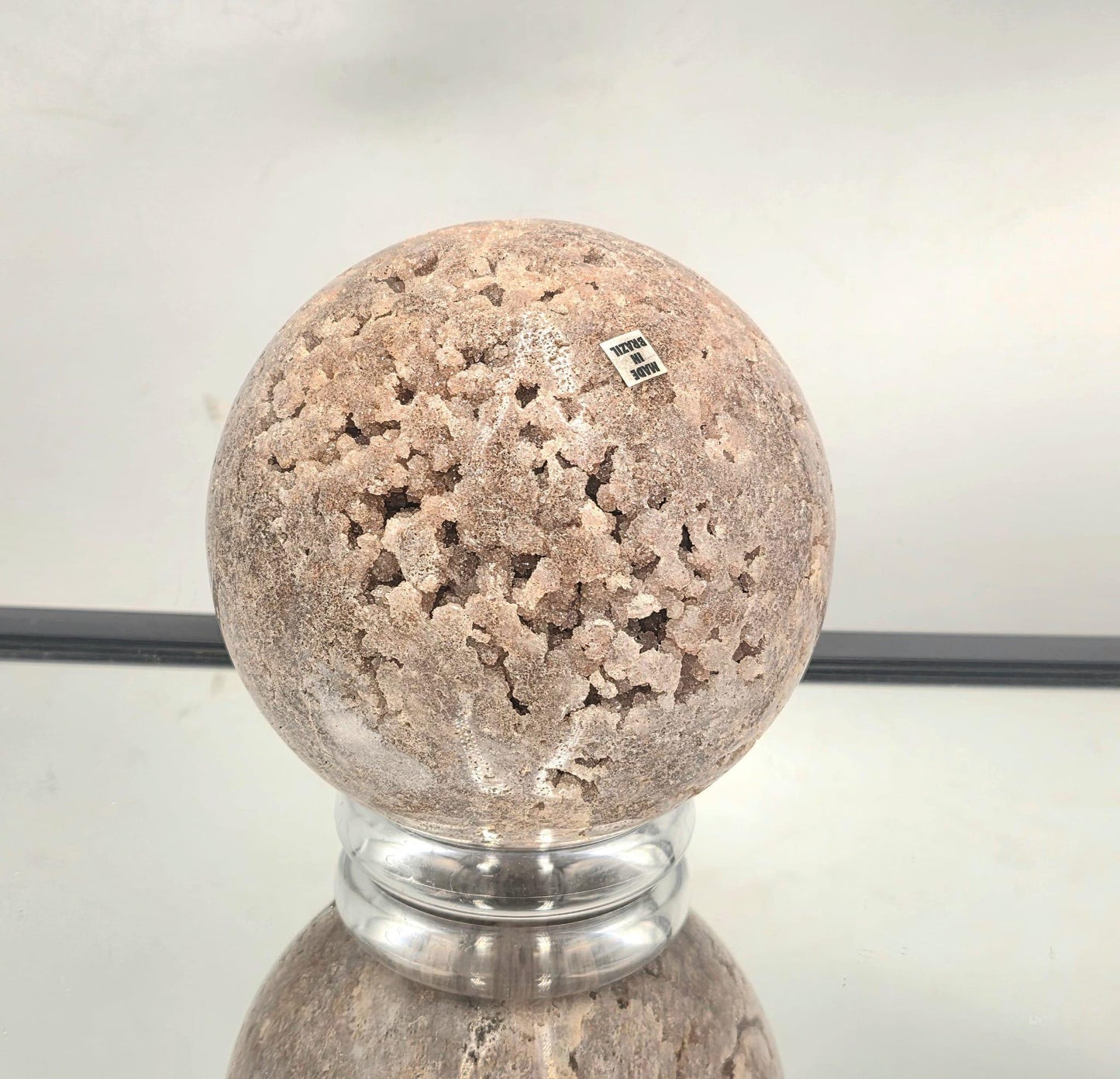 Pink Amethyst sphere showing druzy crystal pocket