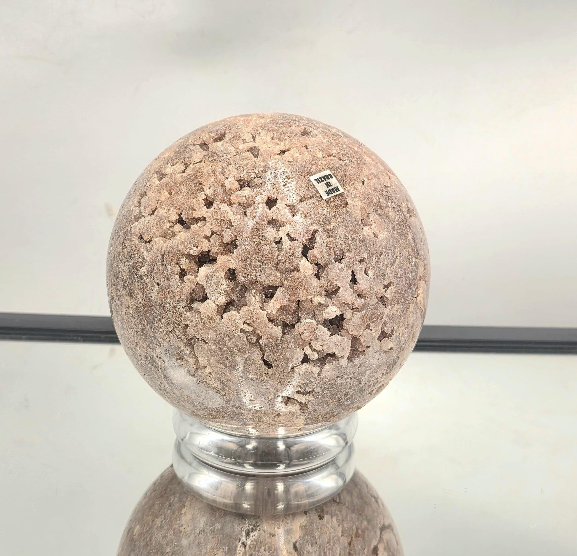 Pink Amethyst sphere showing druzy crystal pocket